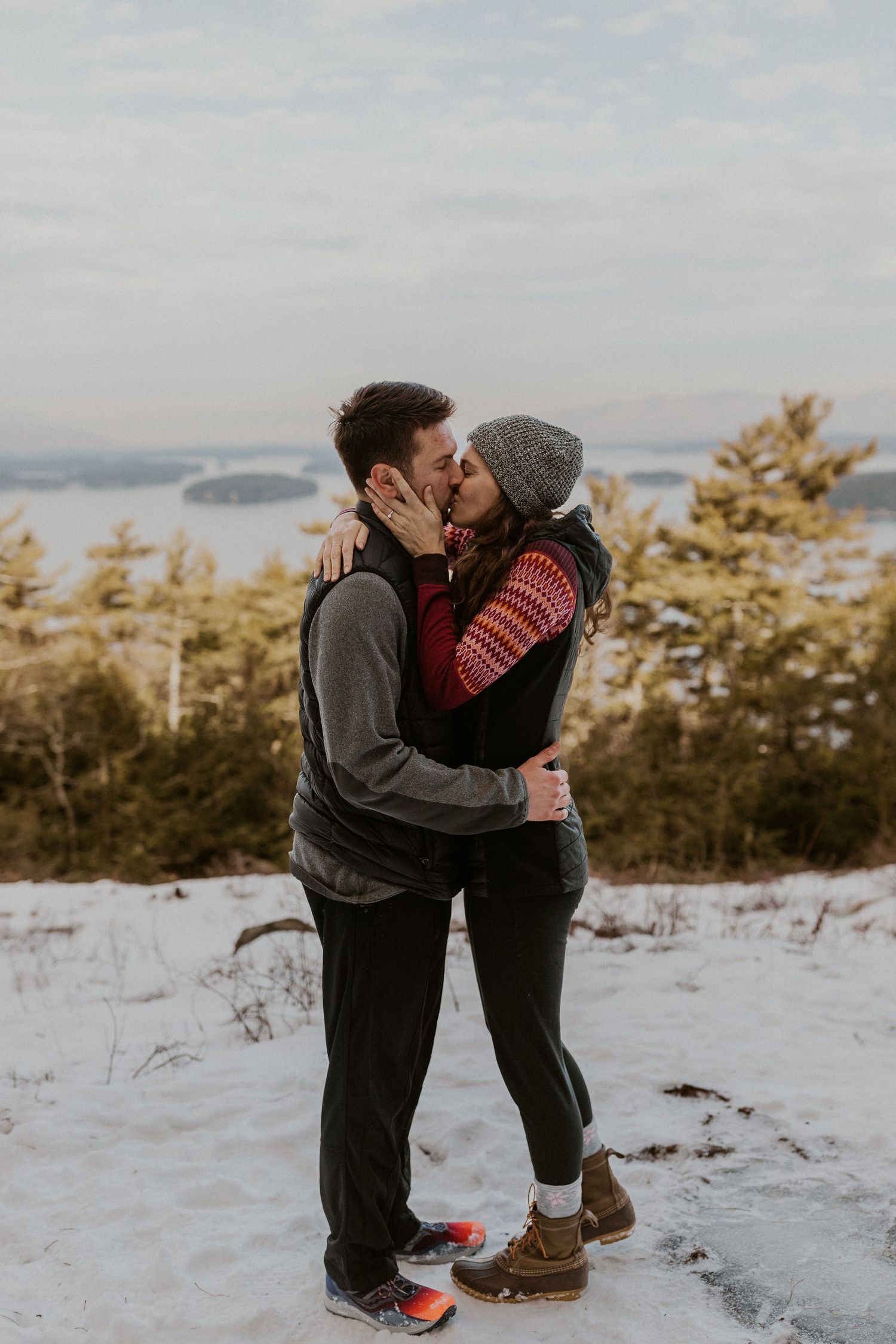 Kirsten and Ivan kissing on Lockes Hill Trail in Gilford New Hampshire.