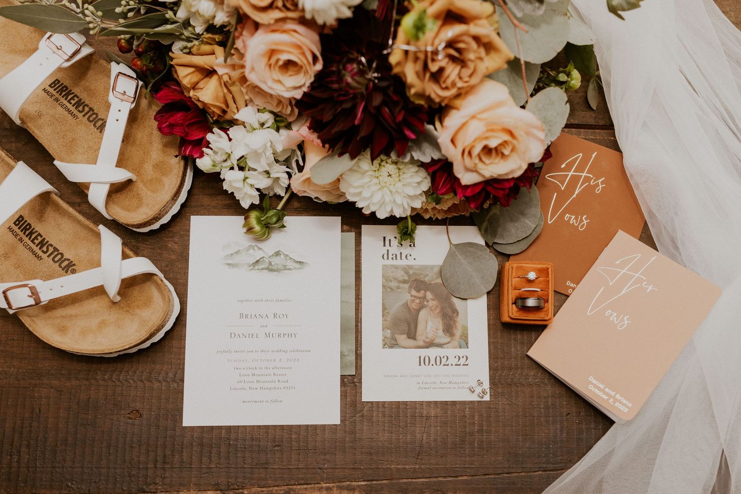 A flat lay photograph of the details from Briana and Daniel's wedding day in the White Mountains of New Hampshire.