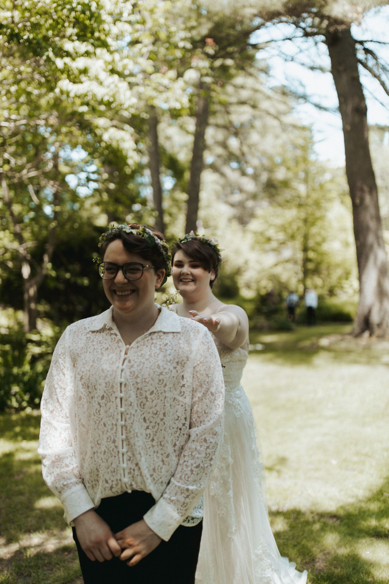 Candid wedding photos taken in a sunny outdoor garden setting.