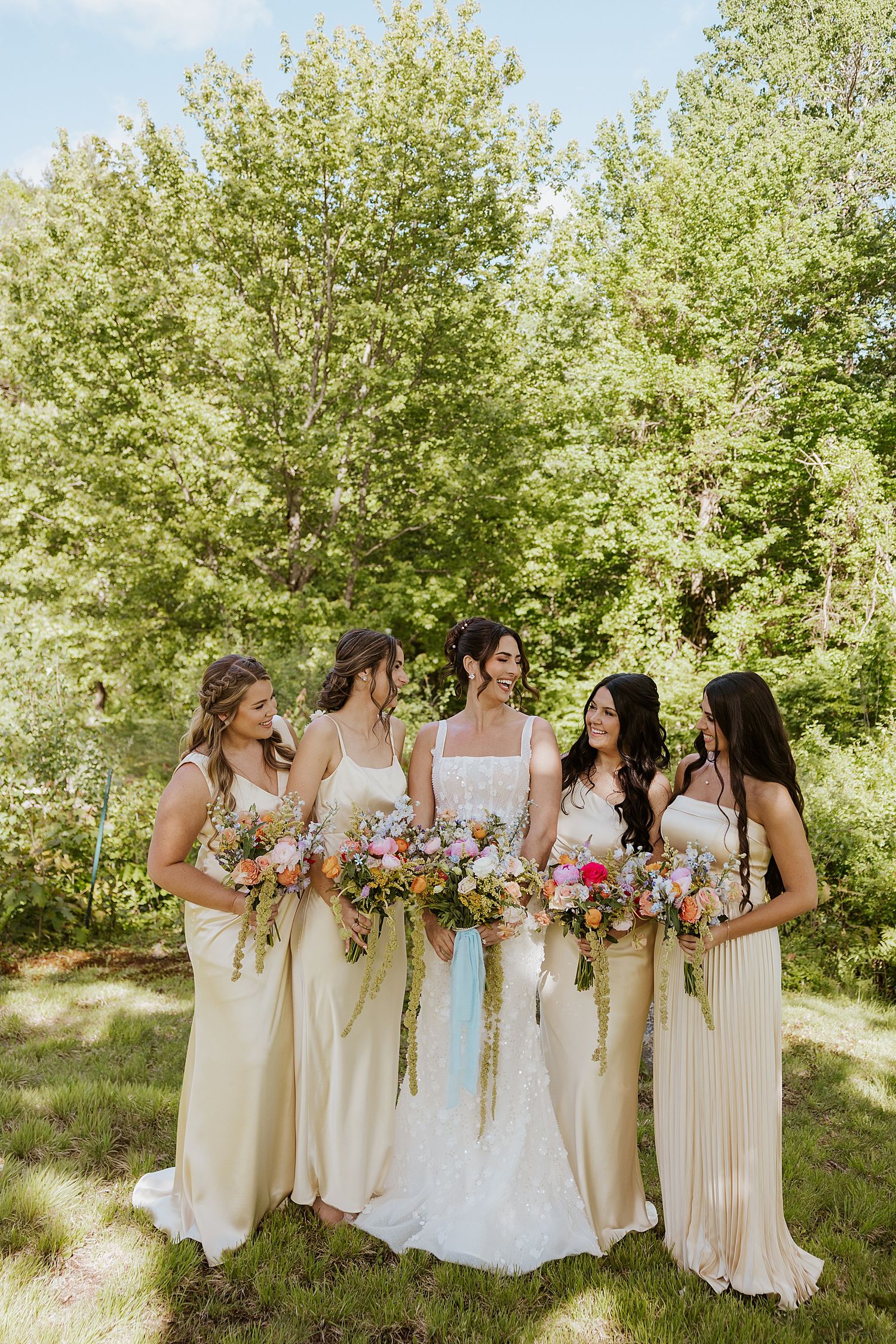 Bride and her bridesmaids taking portraits at a NH wedding at Longlook Farm