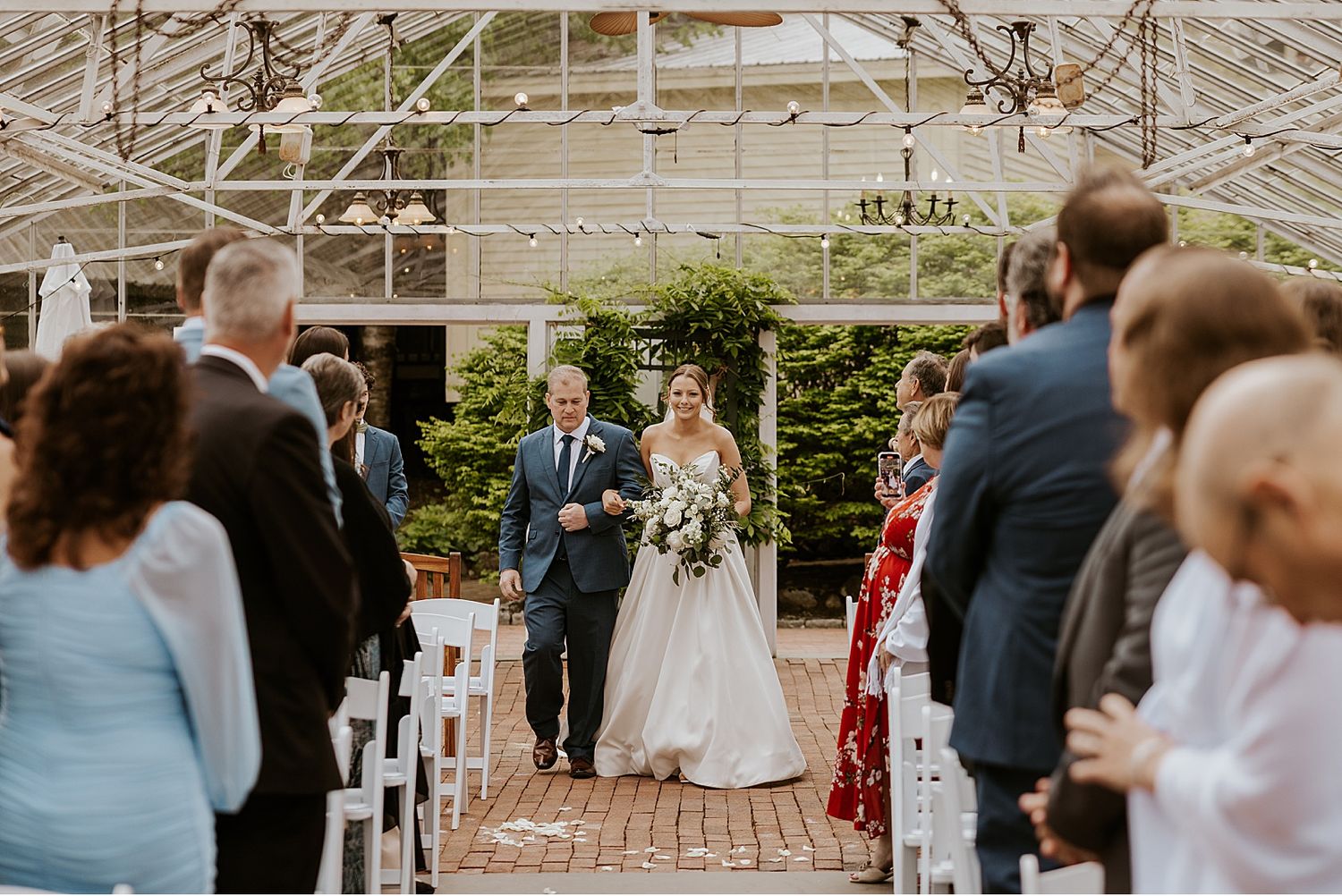 Bride walking down the aisle at her Barn on the Pemi wedding