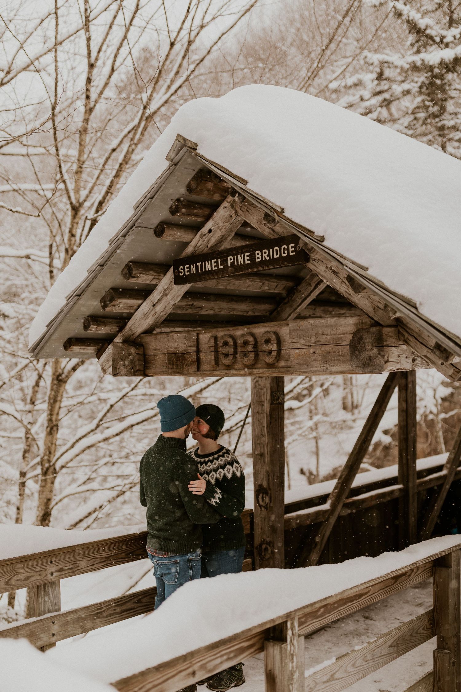 Taylor and Ken snuggling up together in a White Mountain National Forest Shelter while hiking the Flume Gorge in NH.