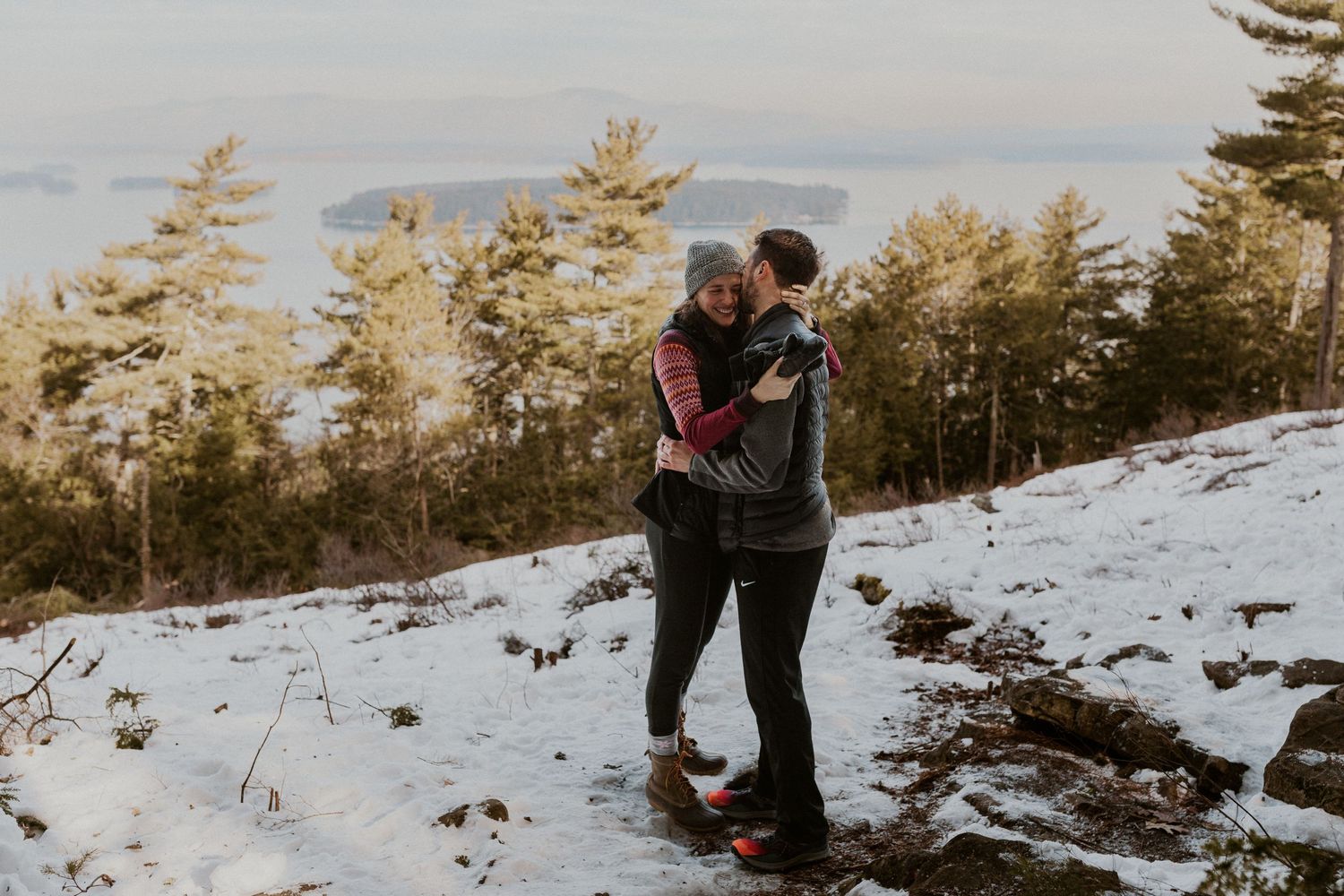 Kirsten hugging onto Ivan after he proposed to her on Lockes Hill Trail in Gilford New Hampshire.