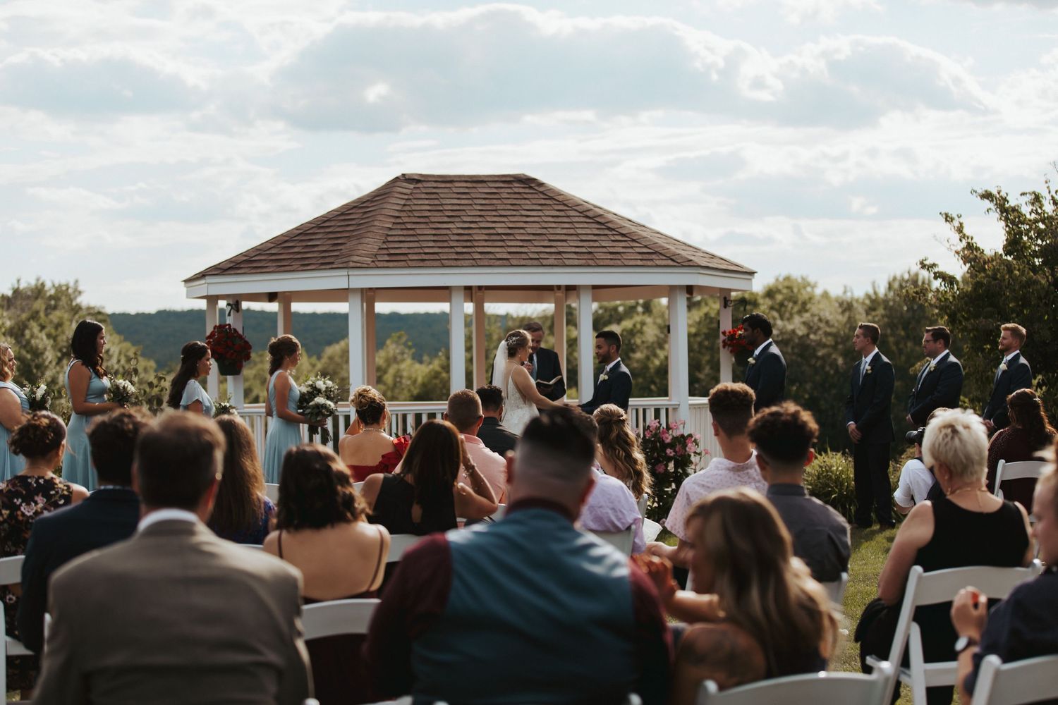 wedding ceremony on an august day at Dell-Lea Weddings and Events in Chichester New Hampshire