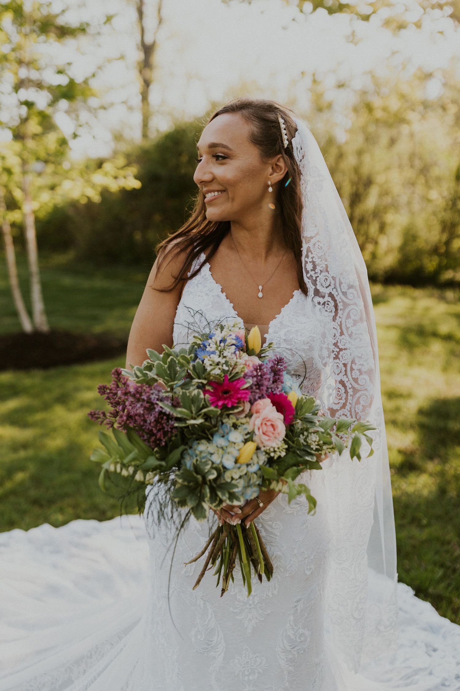 A bridal portrait of Chrissy with her beautiful bouquet and the golden hour light.