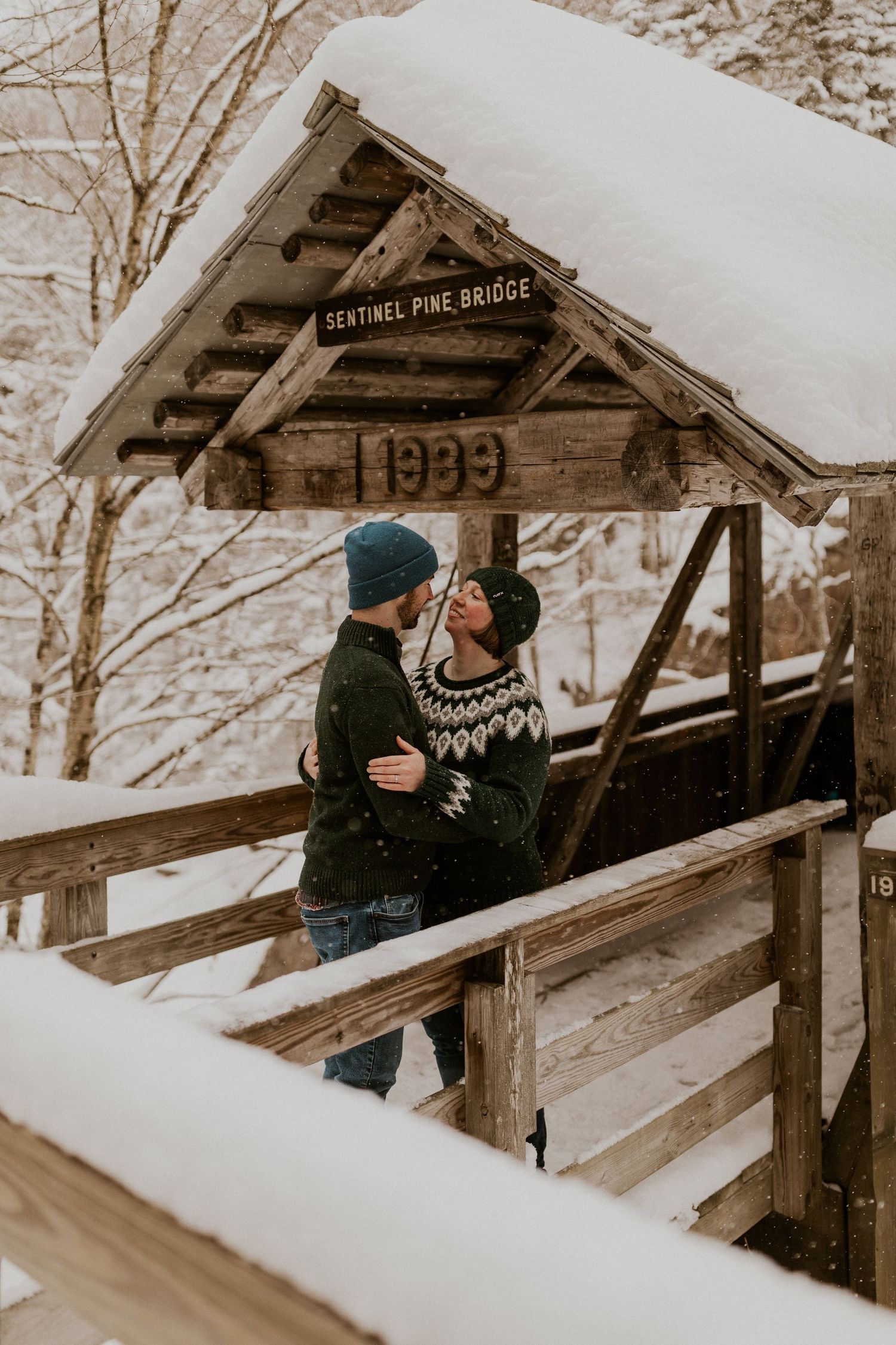 Taylor and Ken snuggling up together in a White Mountain National Forest Shelter while hiking the Flume Gorge in NH.