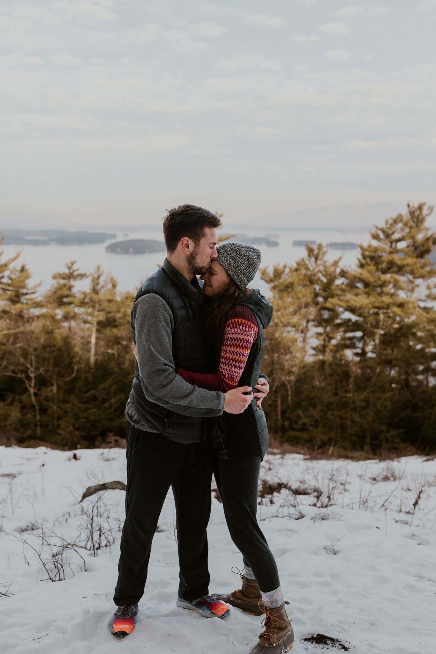 Kirsten hugging onto Ivan after he proposed to her on Lockes Hill Trail in Gilford New Hampshire.