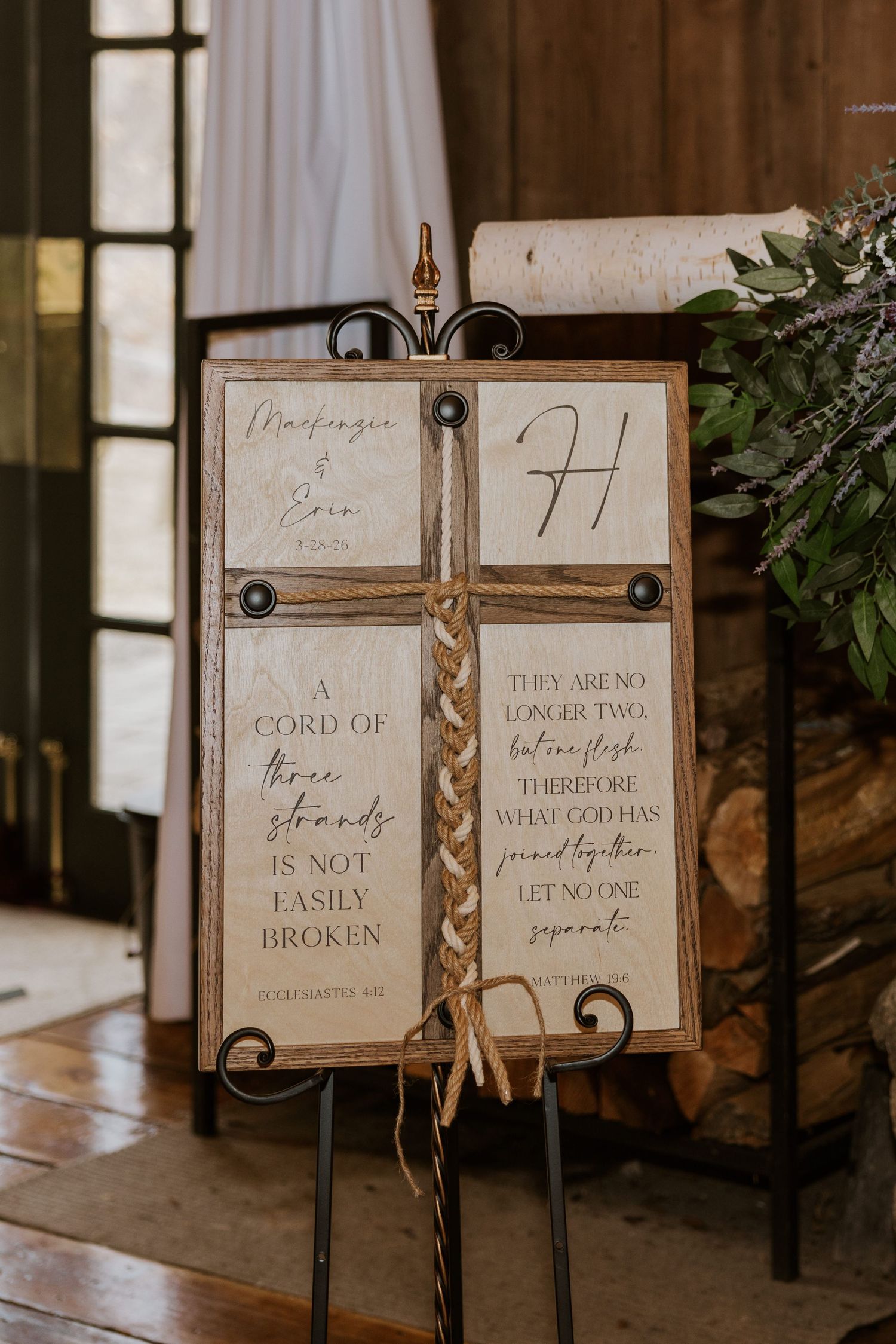 Wedding signage displays romantic quotes on metal stands with twine accents.