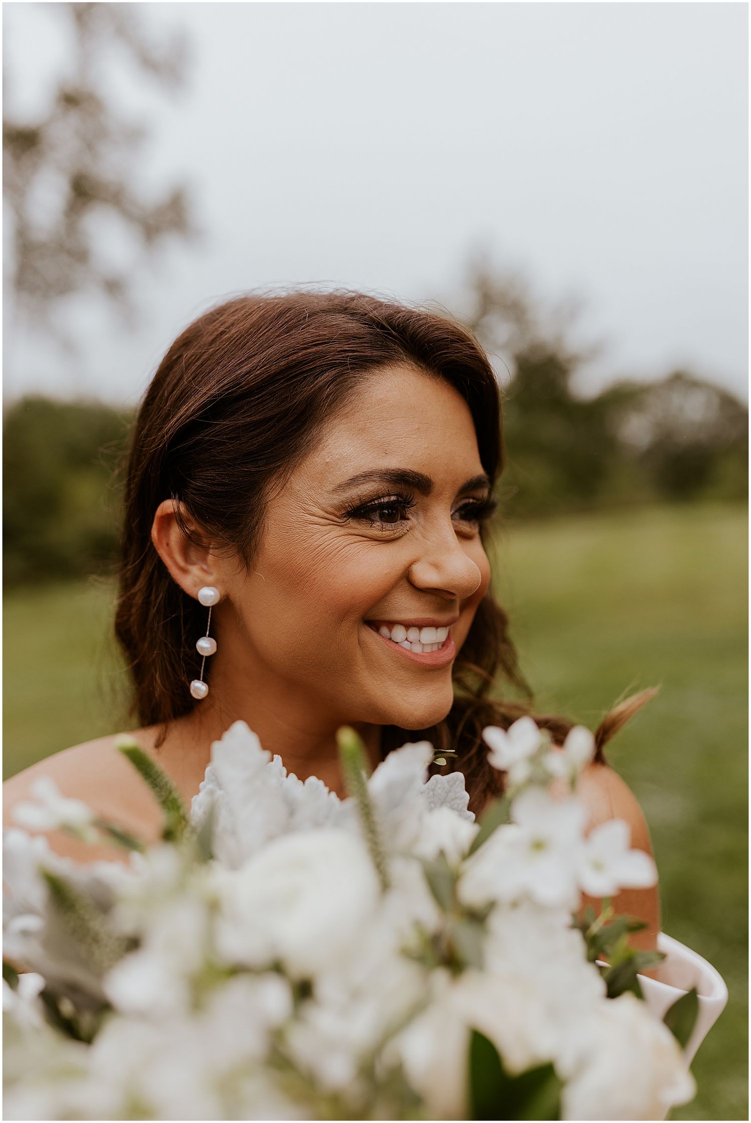 Bride with all white wedding bouquet
