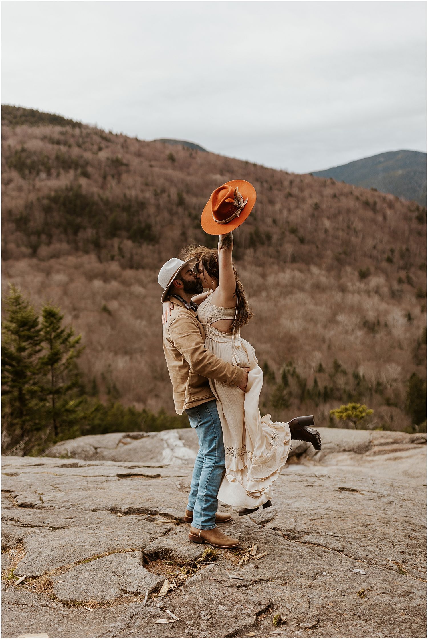 NH couple taking boho engagement photons in the mountains in NH