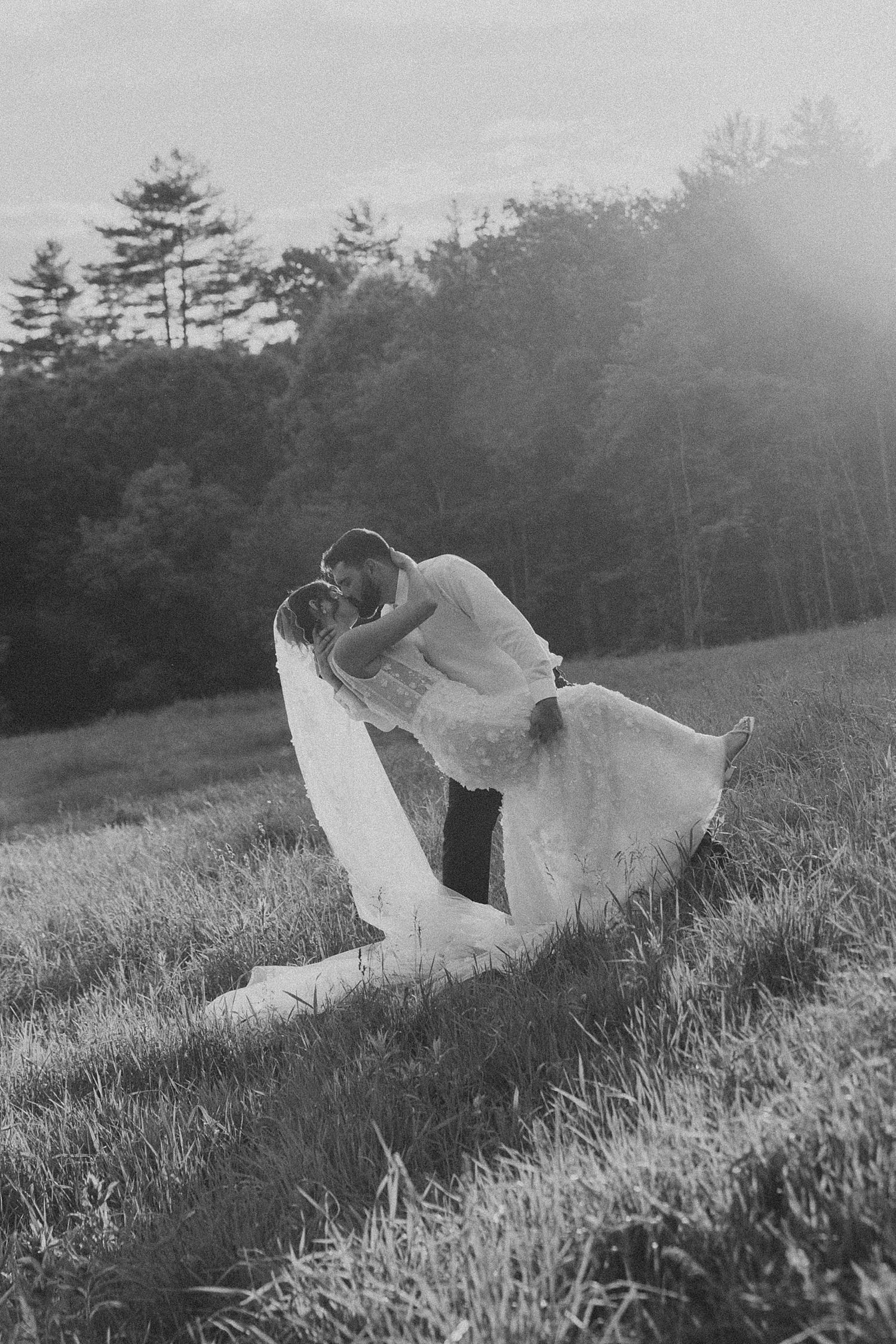 Bride and groom taking golden hour portraits at Longlook Farm NH