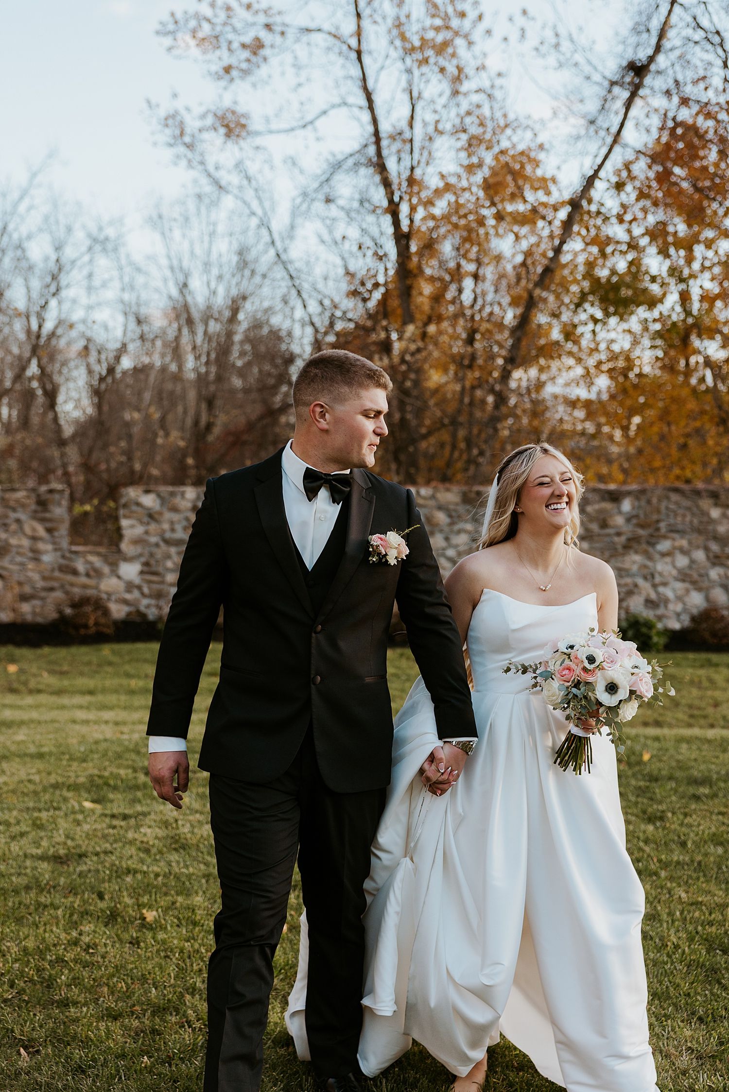 Bride and groom taking portrait photos at their Hyla Brook Estate wedding