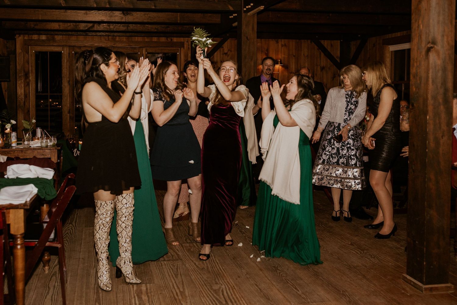 All of the single girls at the wedding trying to catch the bouquet.