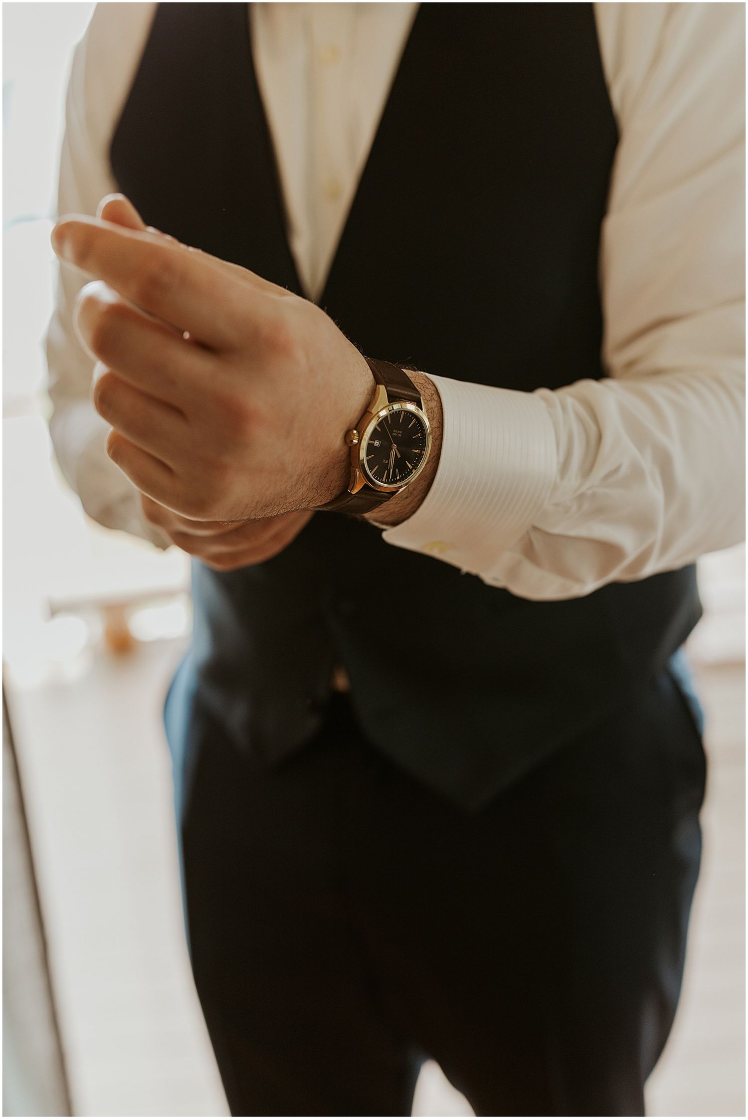 Groom getting ready for his wedding at the Owl's Nest in NH