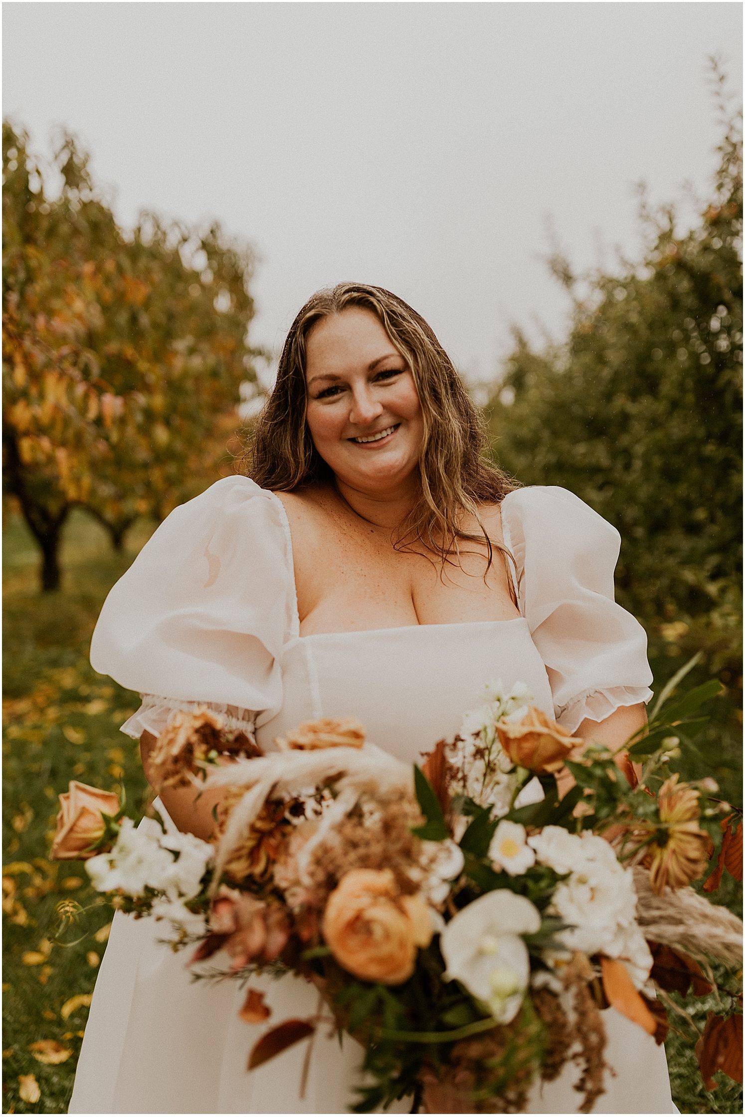 Bride with fall bouquet at NH elopement