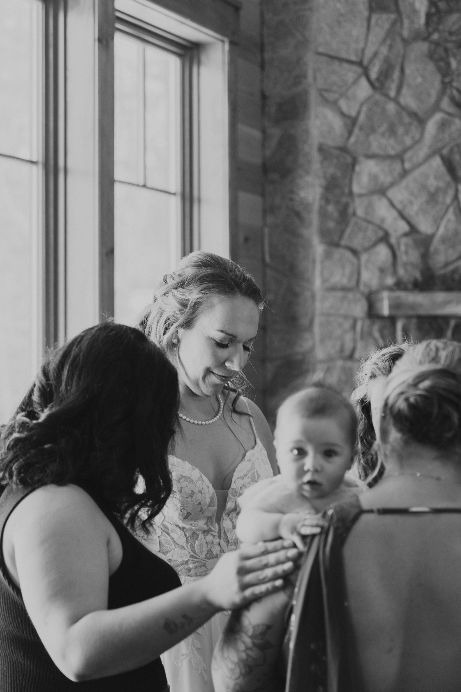 A series of emotional black and white photos showing intimate moments during a wedding preparation.