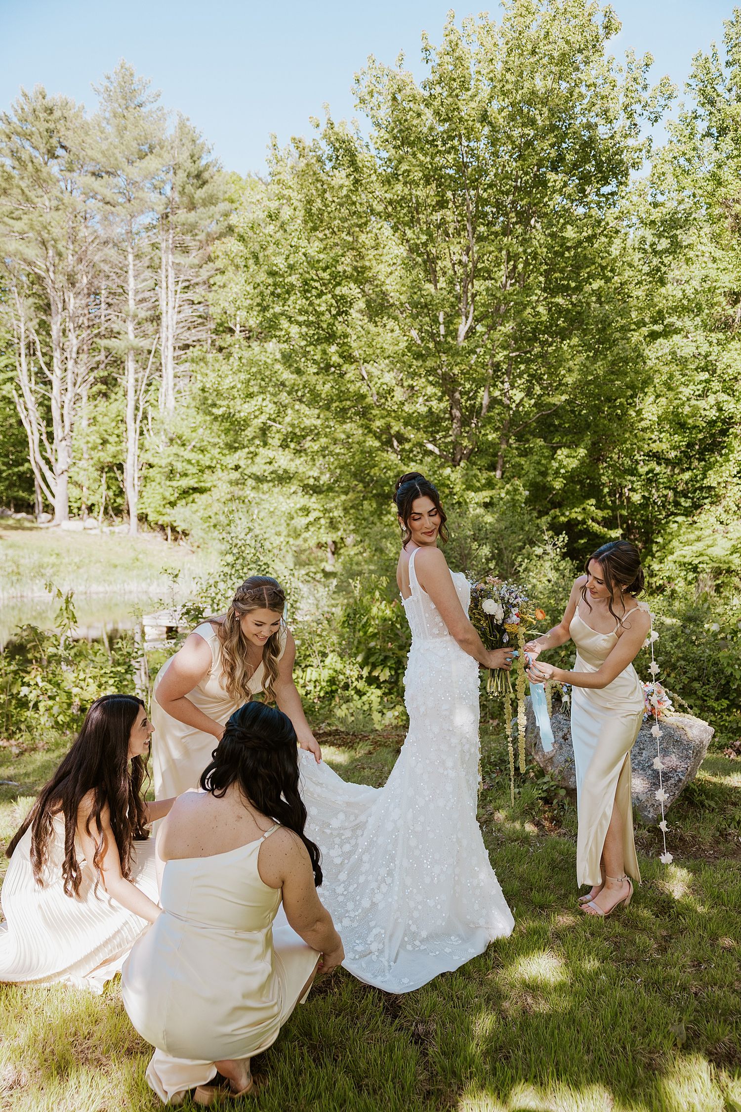 Bride and her bridesmaids taking portraits at a NH wedding at Longlook Farm