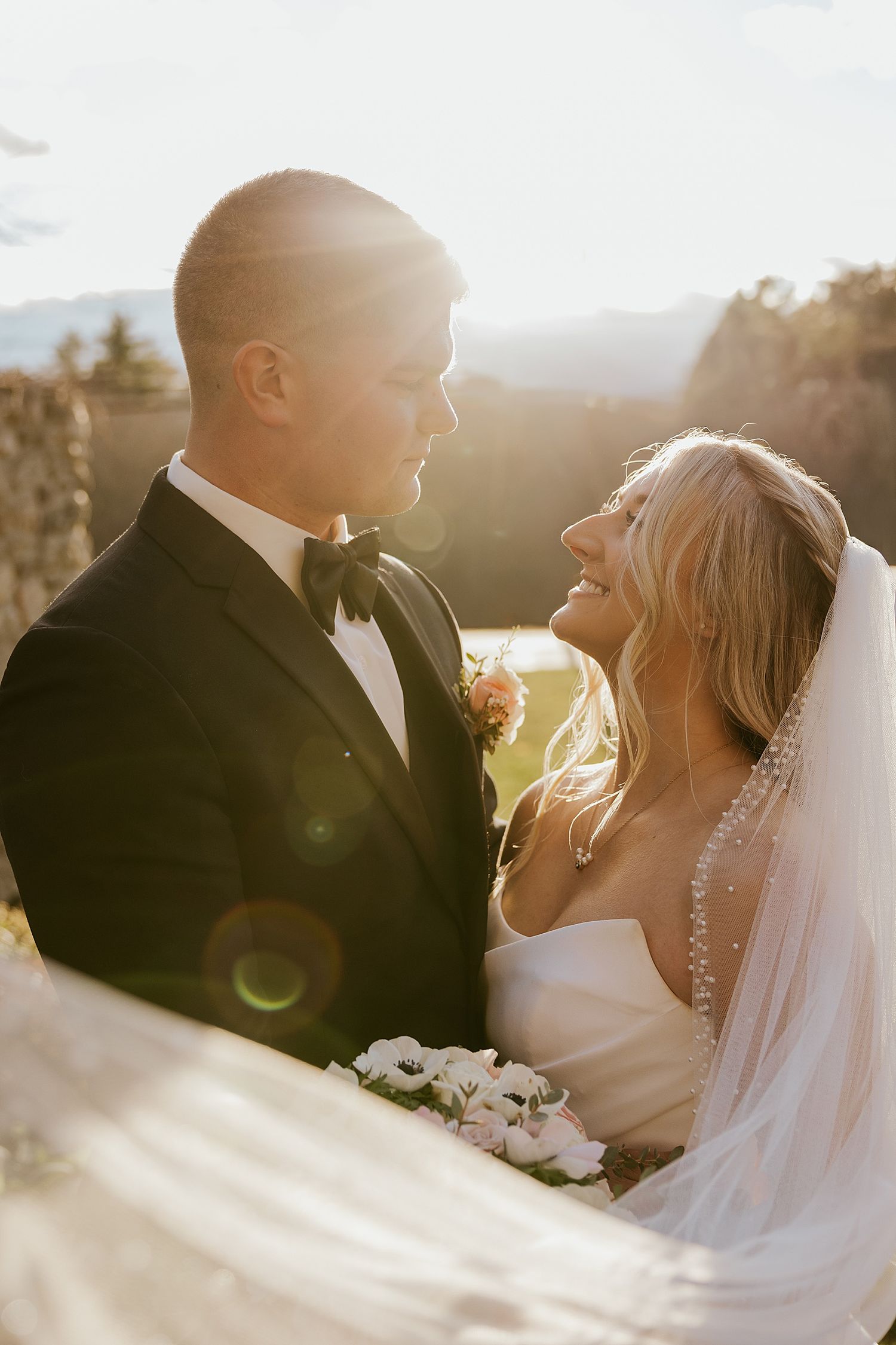 Bride and groom taking golden hour portraits at their Hyla Brook Estate wedding