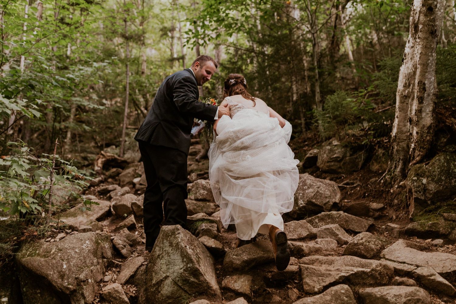 The bride and groom on their way up to the top of Artist Bluff for adventure portraits.