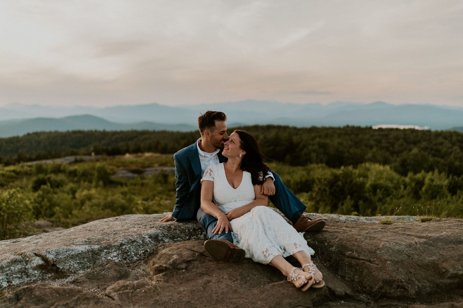 Danielle and Colin dressed in their wedding attire for their one year anniversary photoshoot on Foss Mountain in NH.