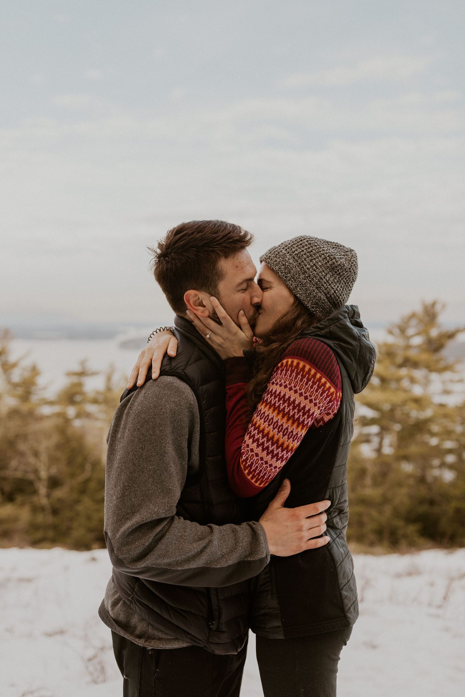 Kirsten and Ivan kissing on Lockes Hill Trail in Gilford New Hampshire.
