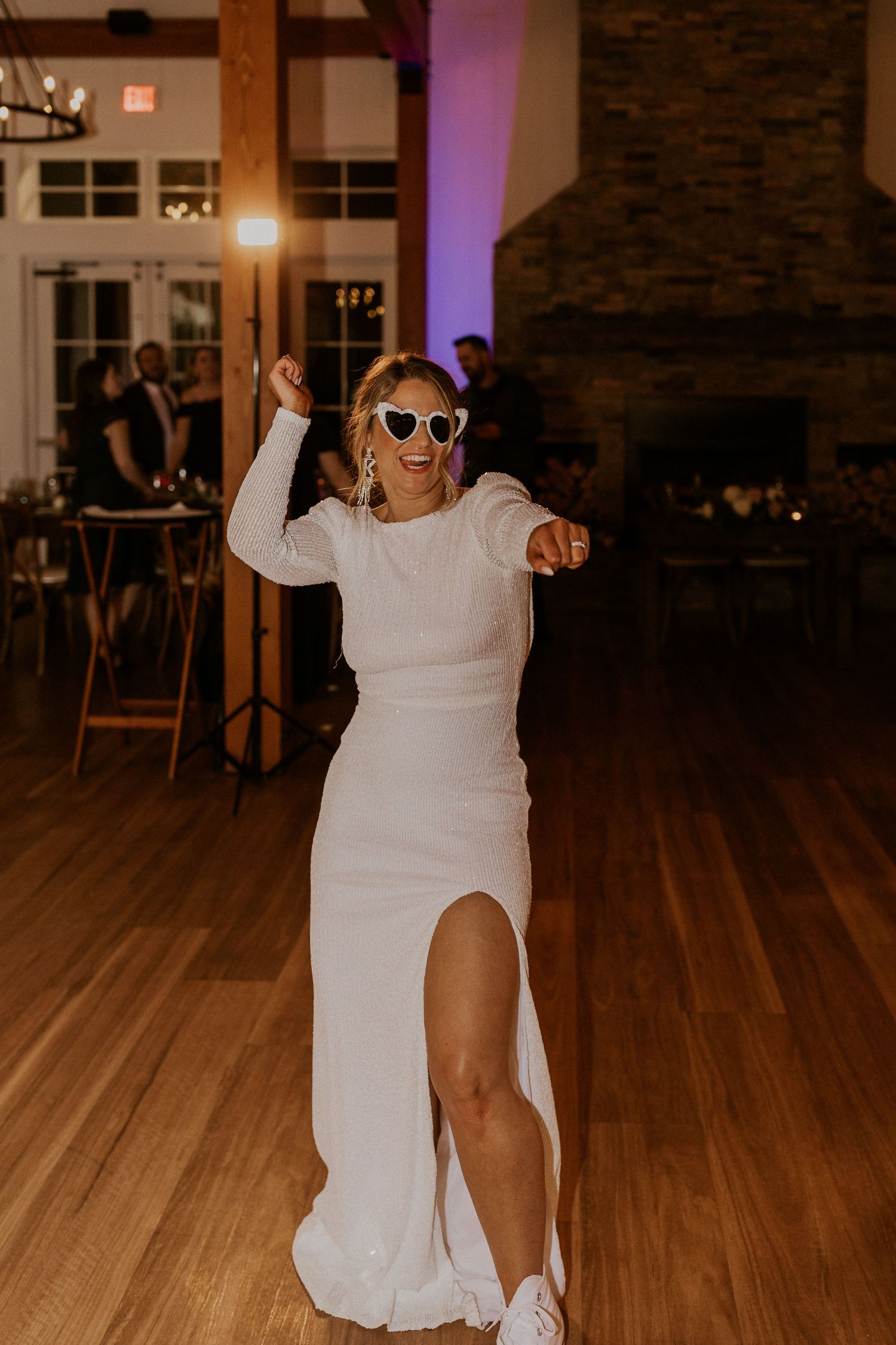 The bride reeling in the groom for some dance floor fun at their wedding reception in Thornton, New Hampshire.