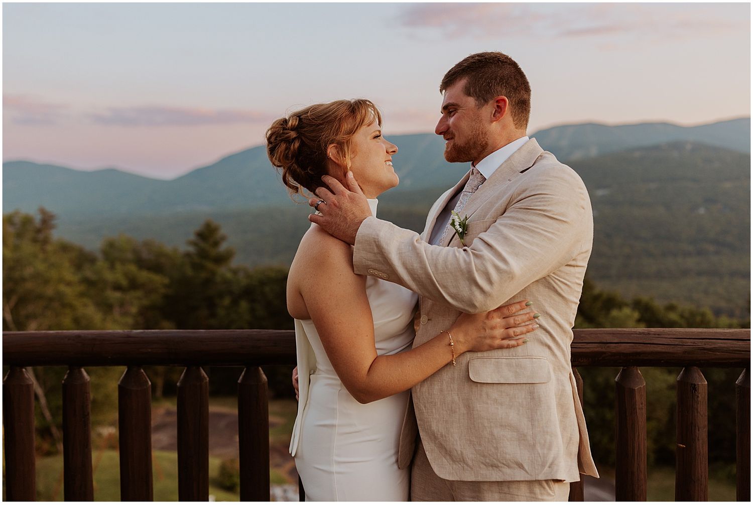 Bride and groom taking sunset photos at their Maine VRBO wedding