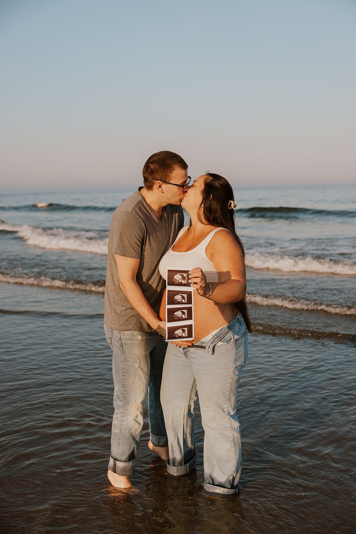 New Hampshire couple taking beach maternity photos