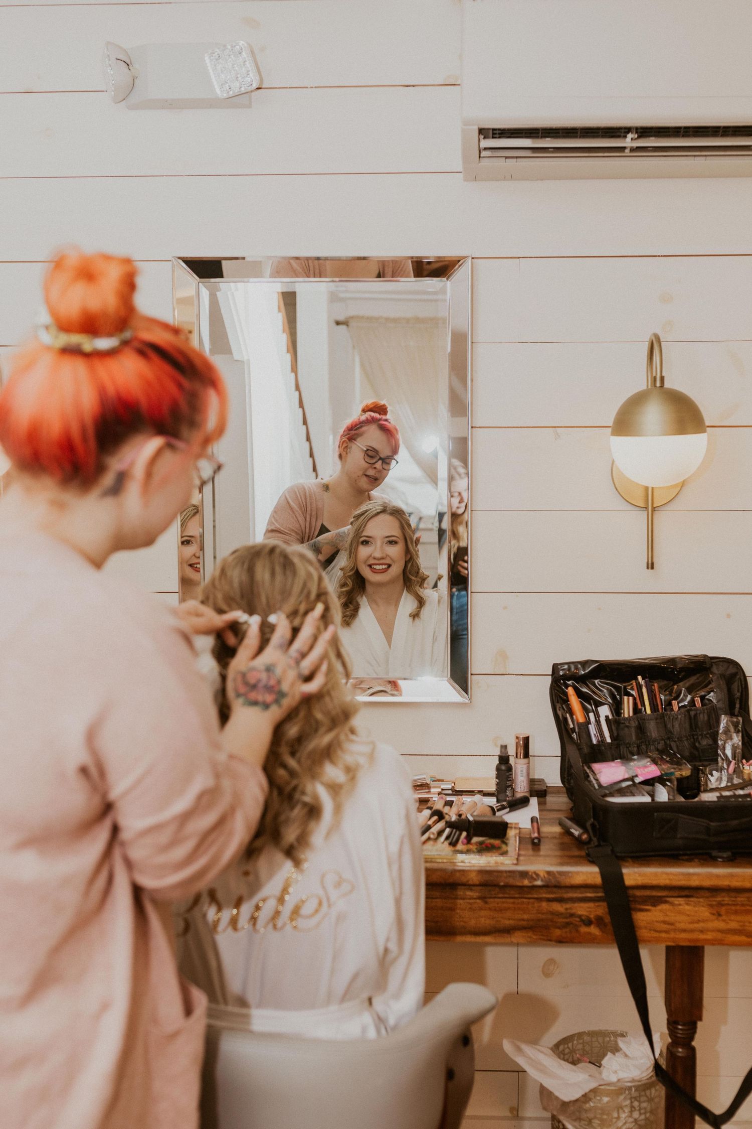 Deirdre is almost done with her hair and makeup in this photo, she was looking at herself in the mirror.