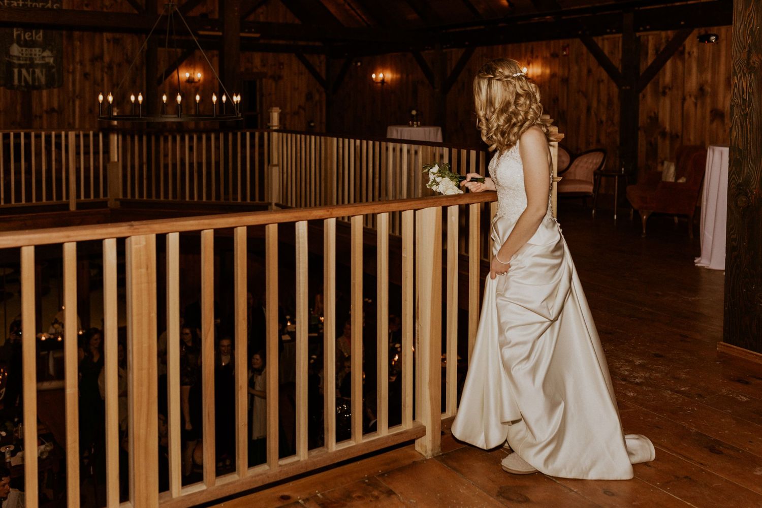 Deirdre getting ready to toss her bouquet over the balcony.