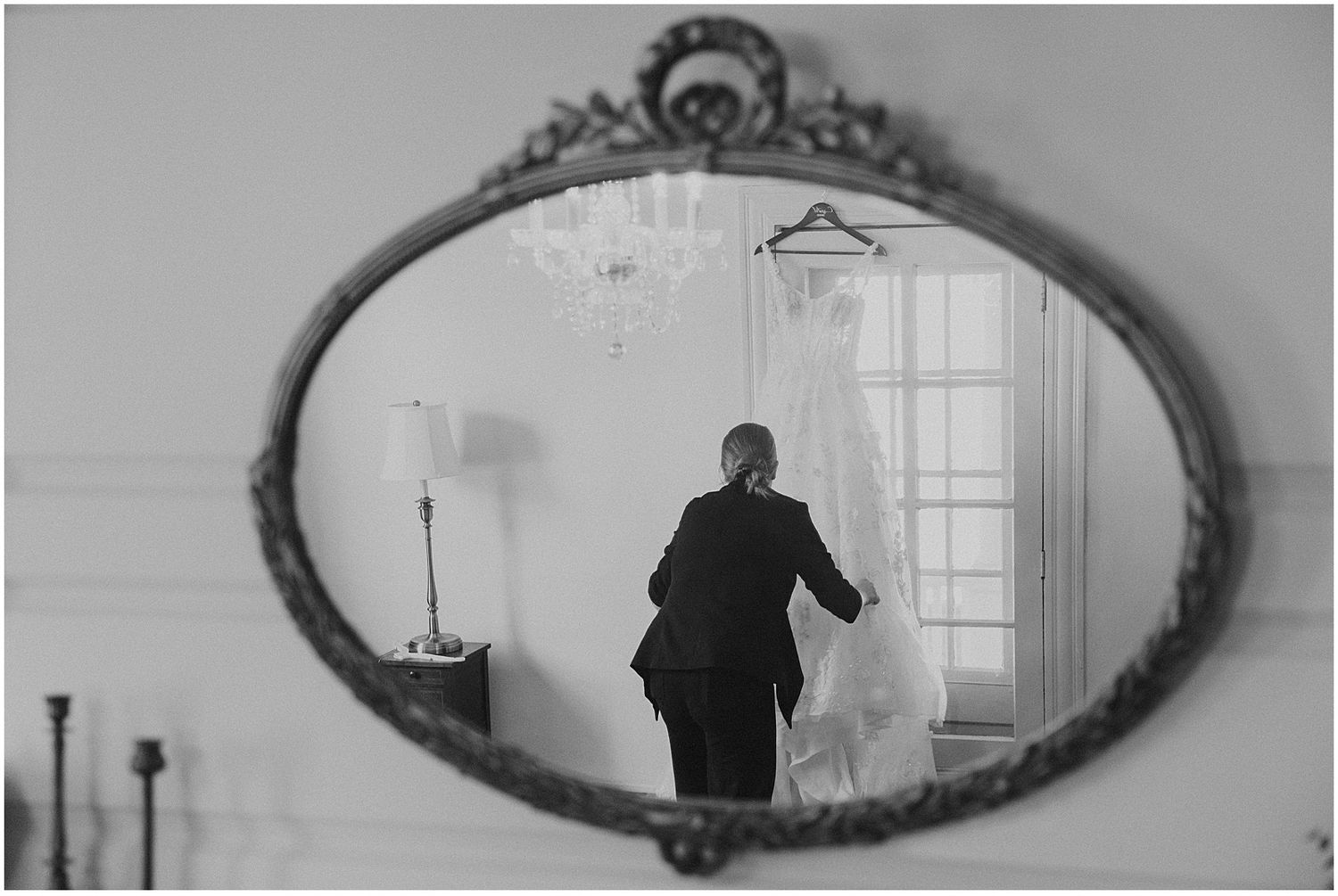 New Hampshire photographer Robin Easler photographing a bride's wedding gown