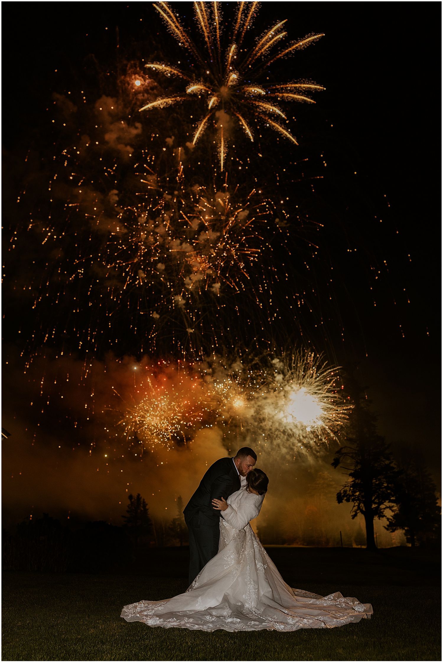 Couple watching fireworks at their Mountain View Grand wedding in New Hampshire