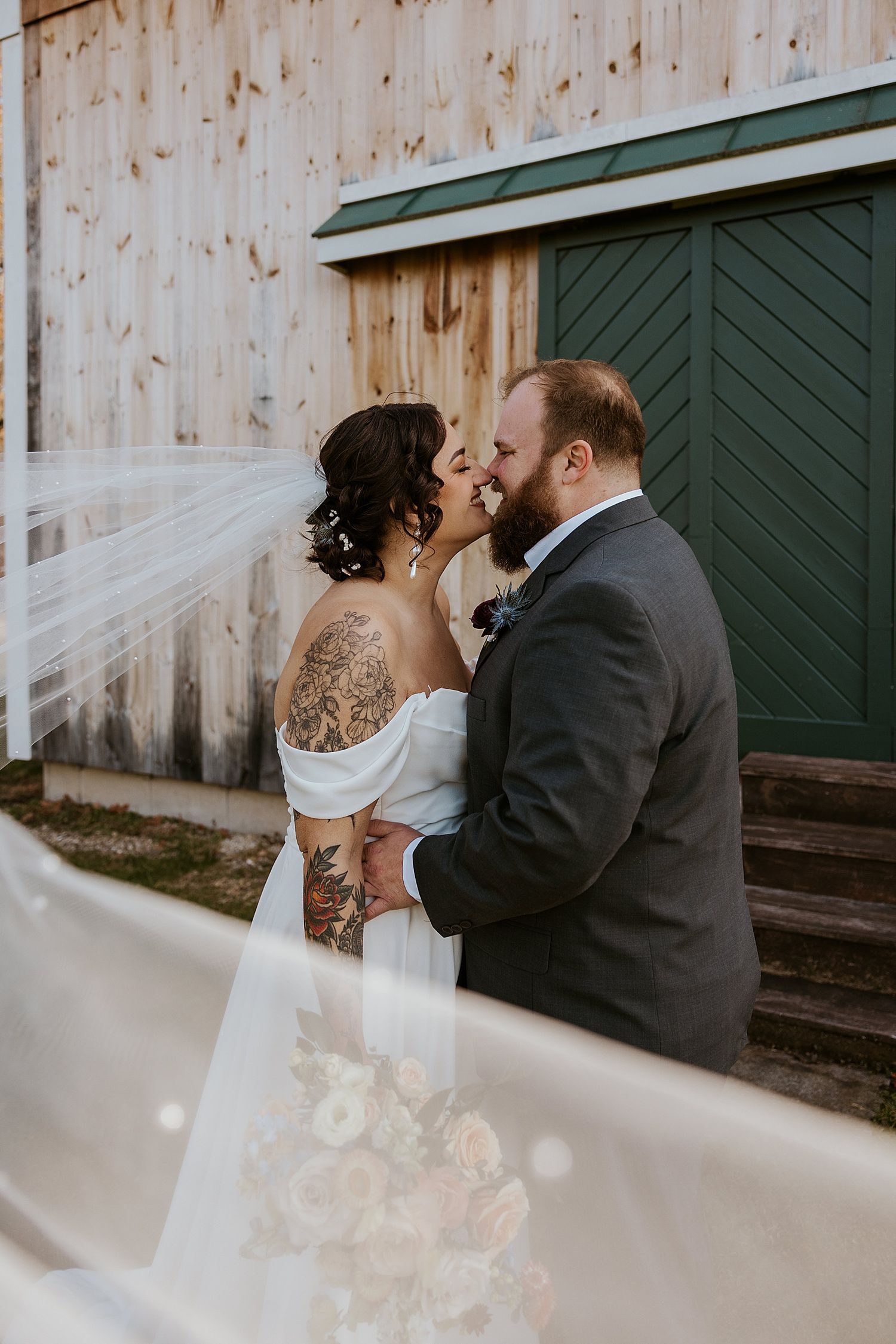 Bride and groom taking portraits on their wedding day at the Barn at Powder Majors Farm in NH