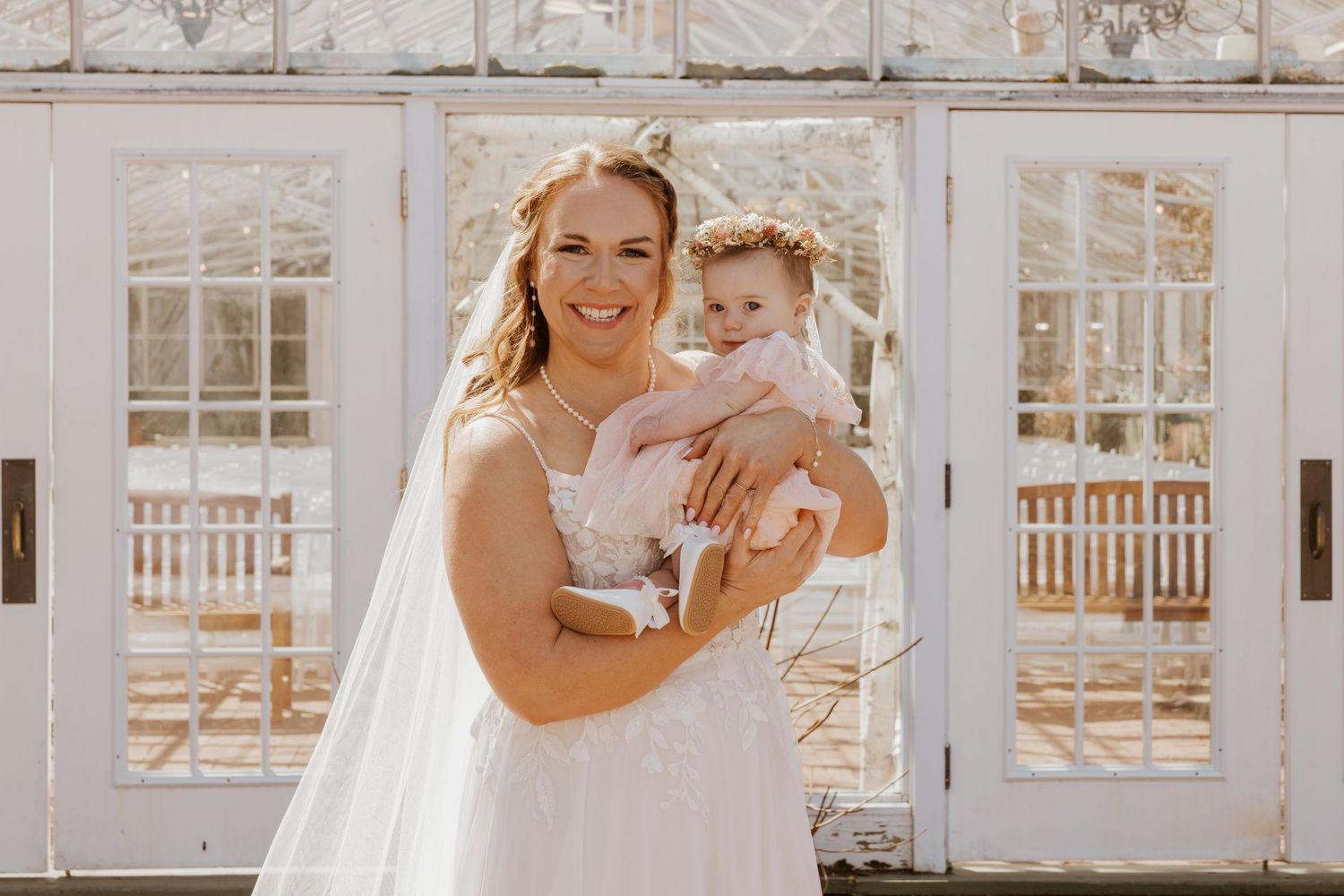 Series of bright white windows in a rustic wedding venue setting.