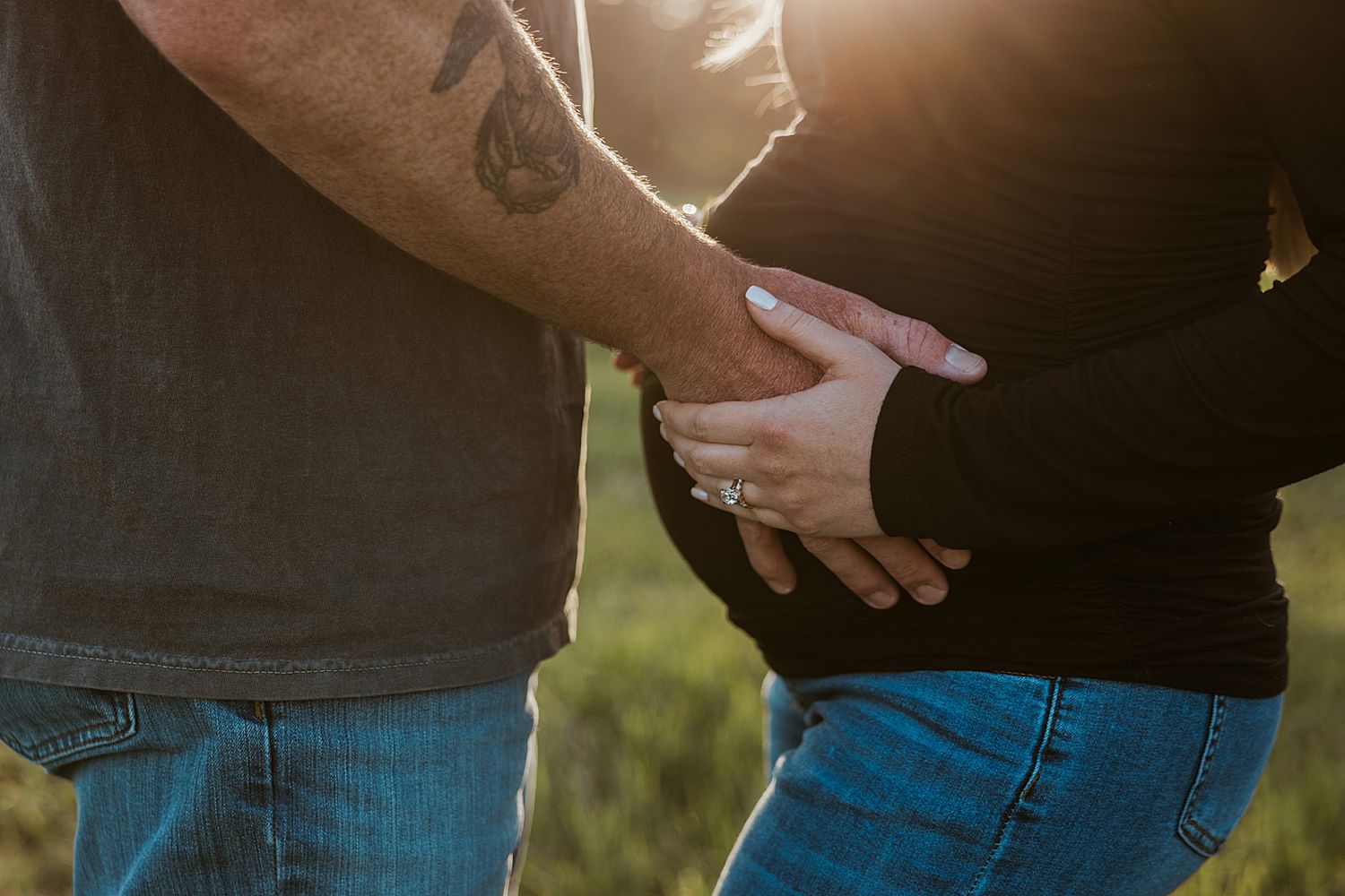 Couple posing for maternity pictures and sharing maternity photo session tips