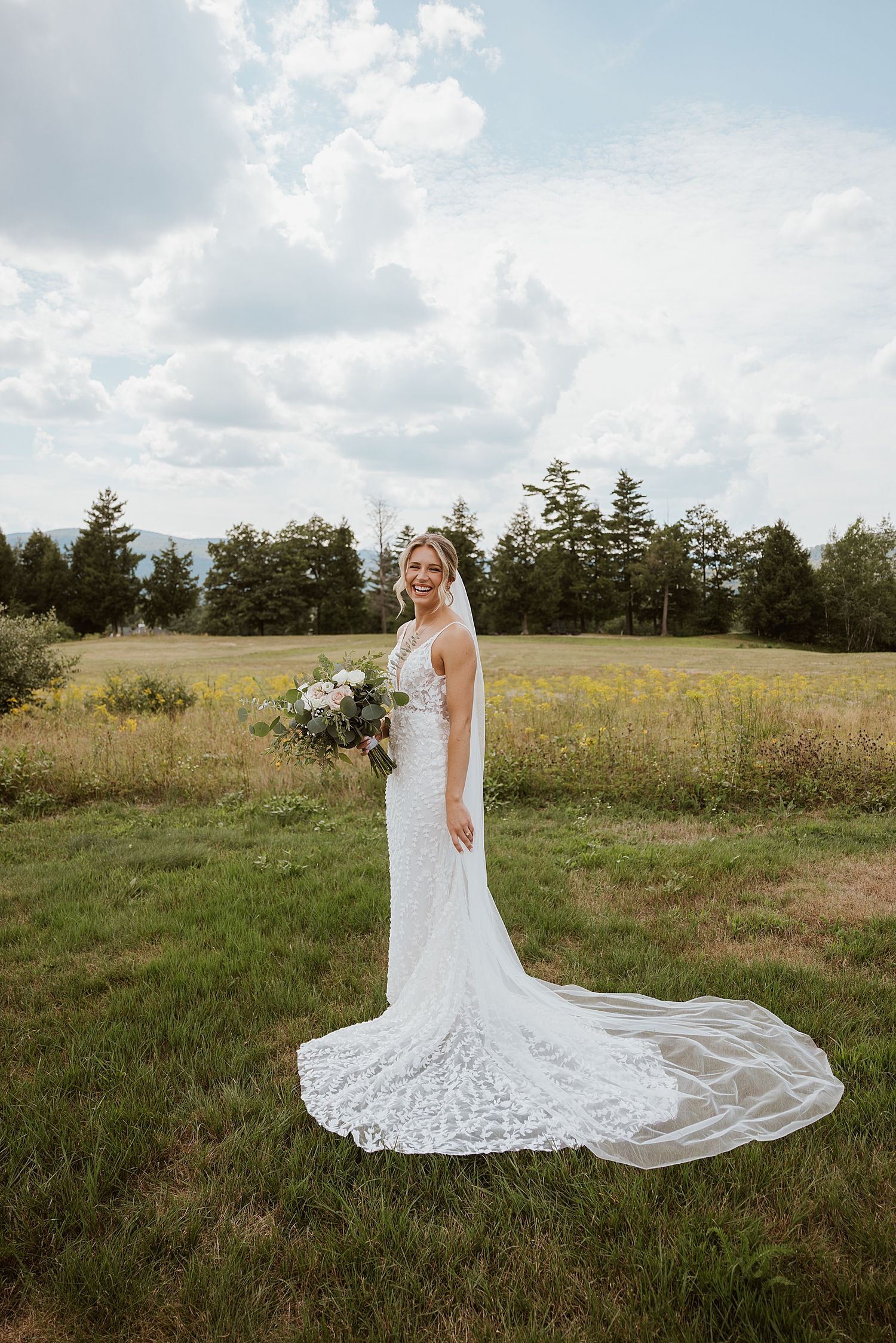 Bride posing for portrait photos at her wedding at the Sunset Pavilion at the Owl's Nest Resort in New Hampshire
