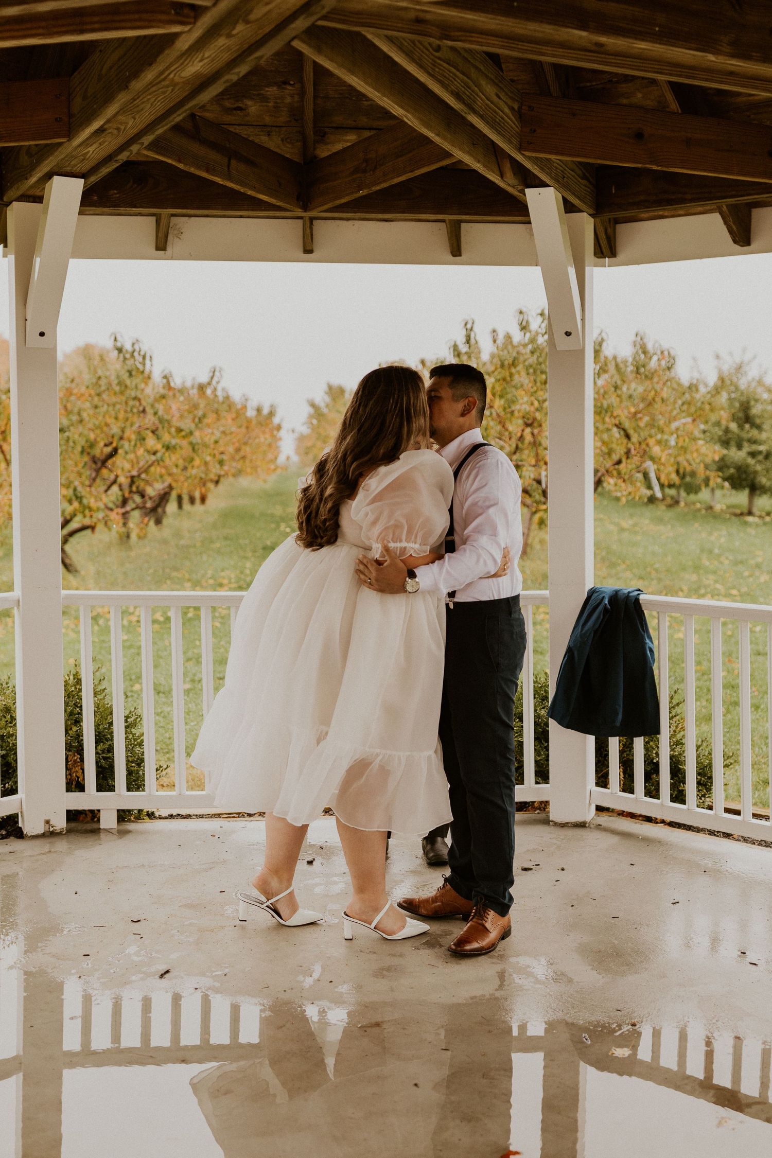 Terise and Jose sharing their first kiss as husband and wife at Carter Hill Orchard in Concord New Hampshire.