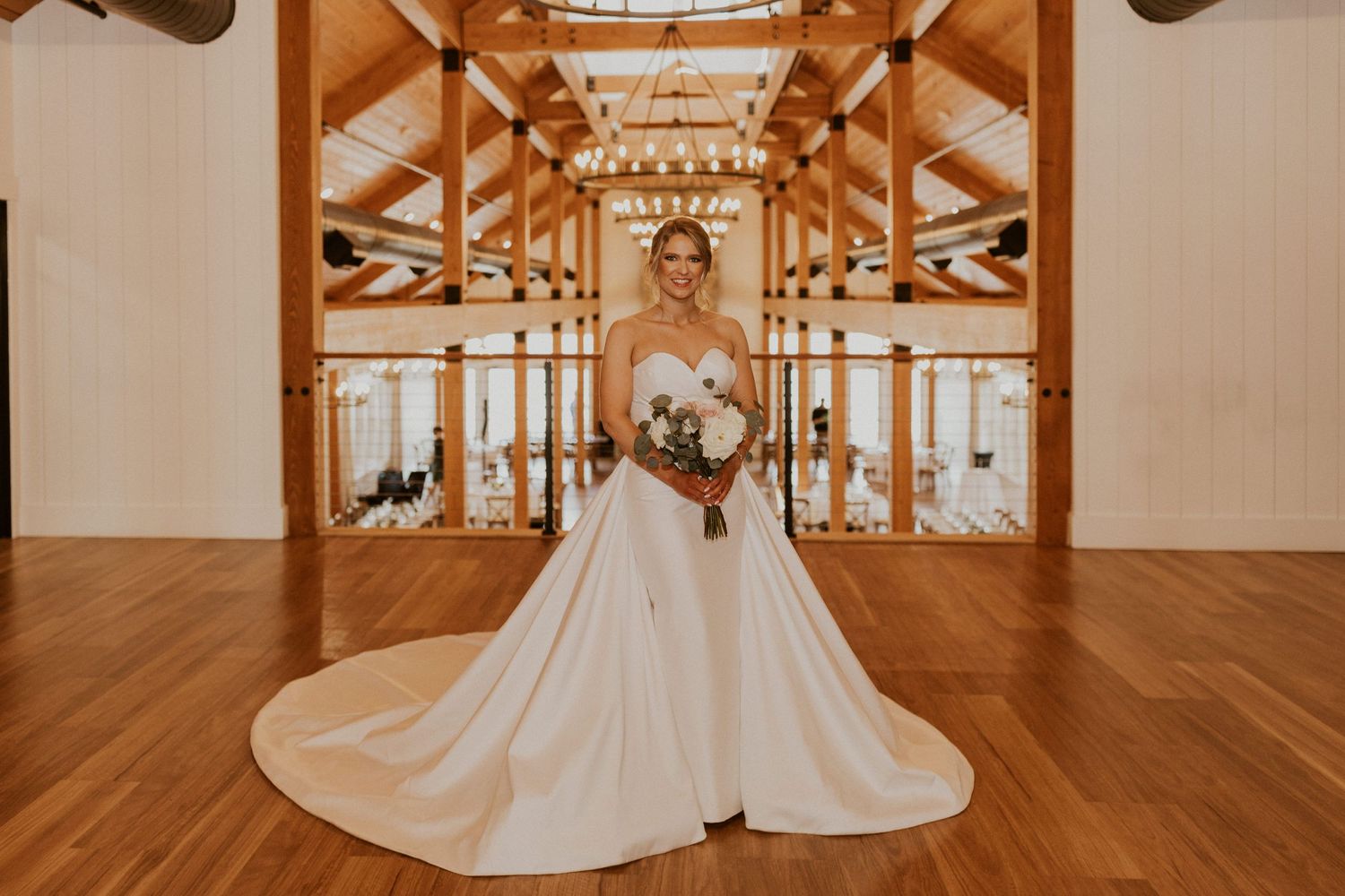 A portrait of Kendra, the bride, in the Lake House of Owl's Nest Resort.