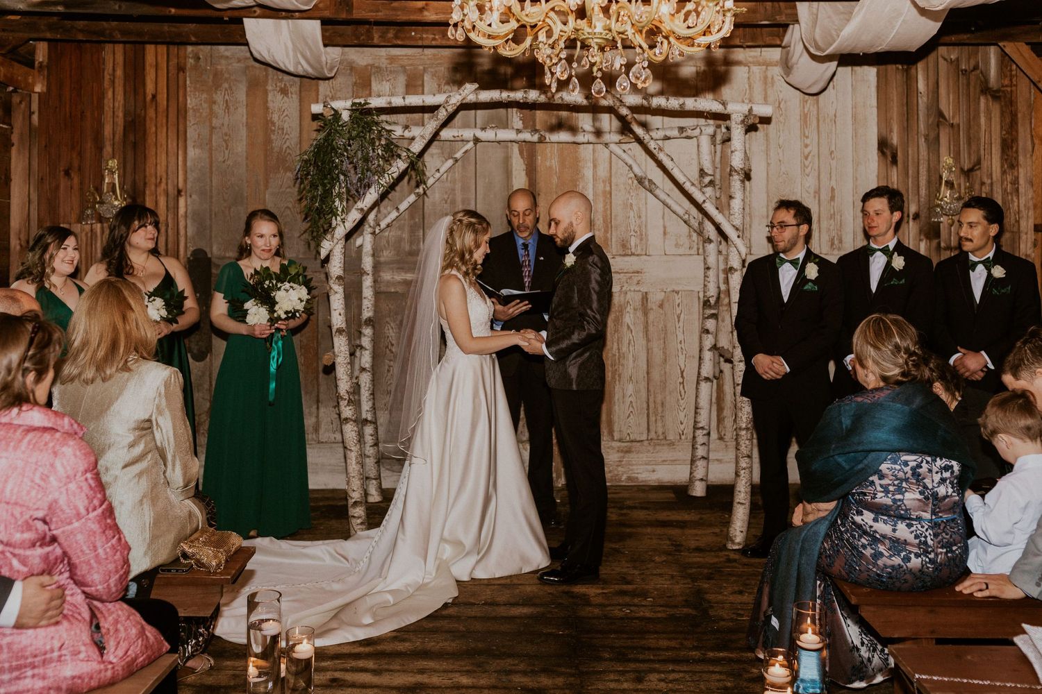Deirdre and Brodie hand in hand during their wedding ceremony in Tamworth New Hampshire.