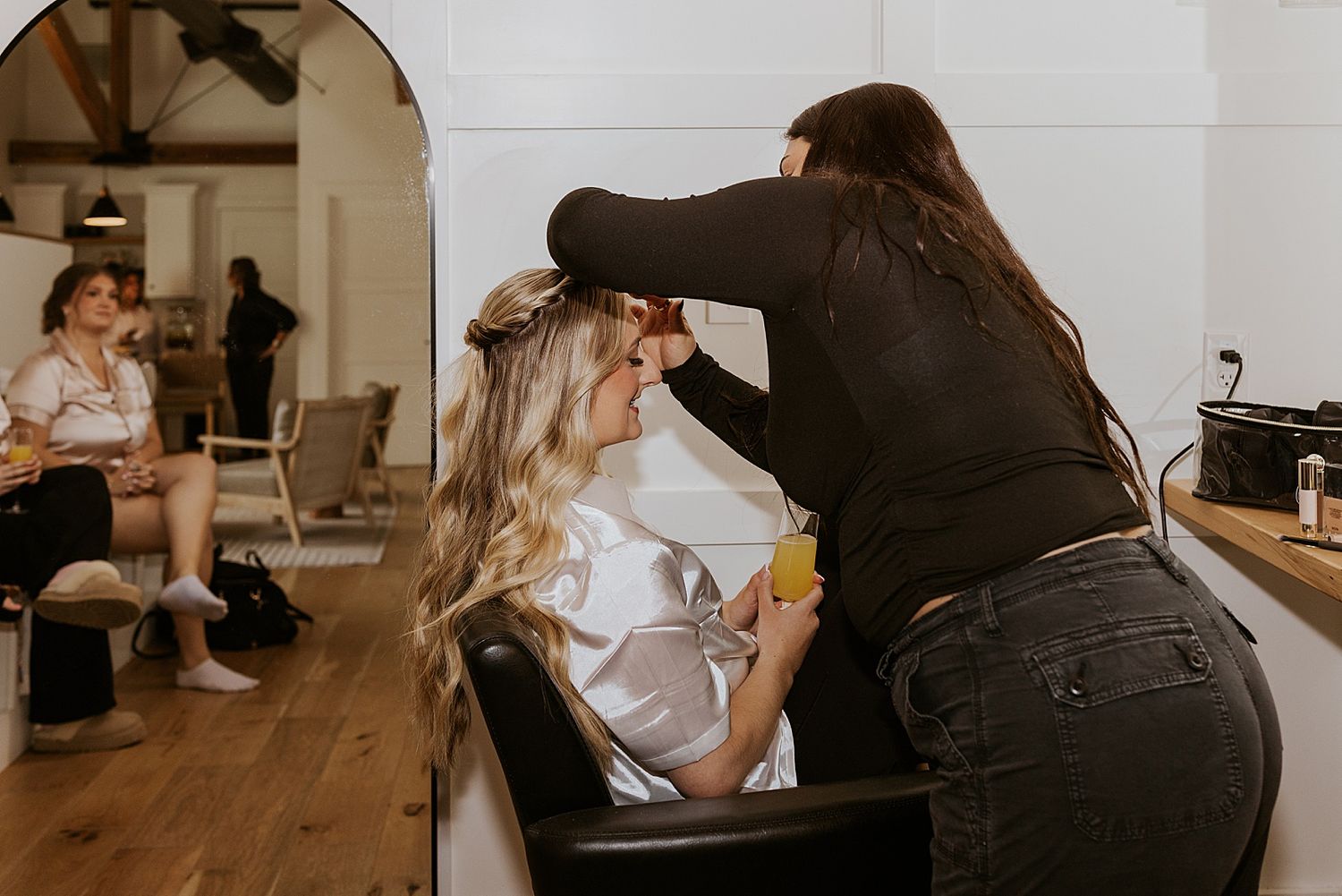 Bride getting her makeup done for her Hyla Brook Estate wedding in NH