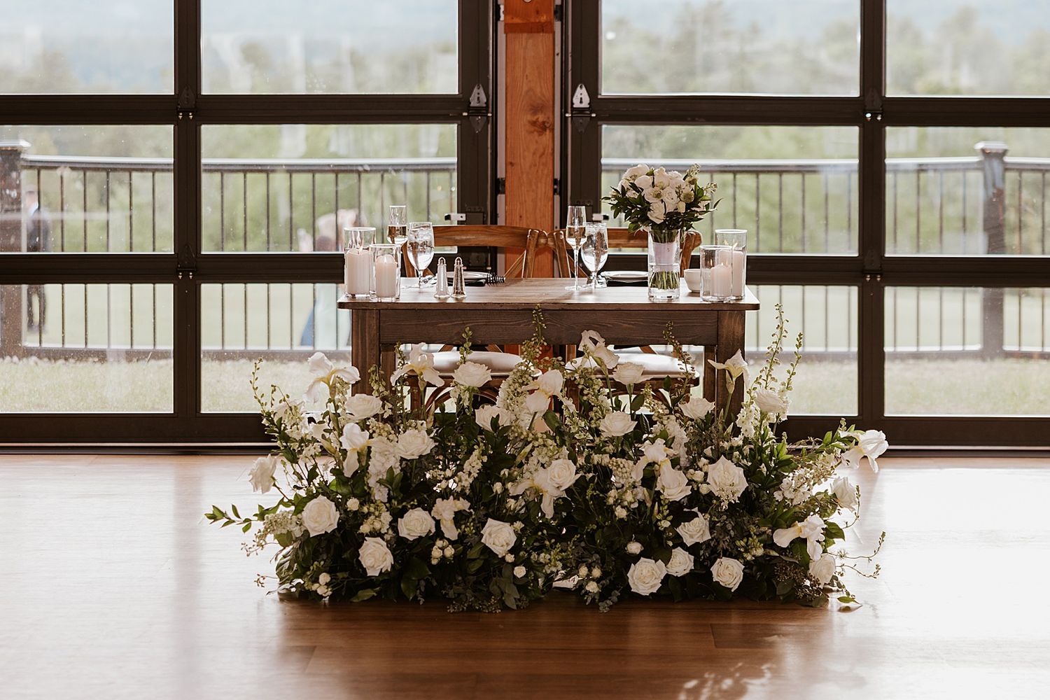 Sweetheart table decor at an Owl's Nest wedding inside the Sunset Pavilion