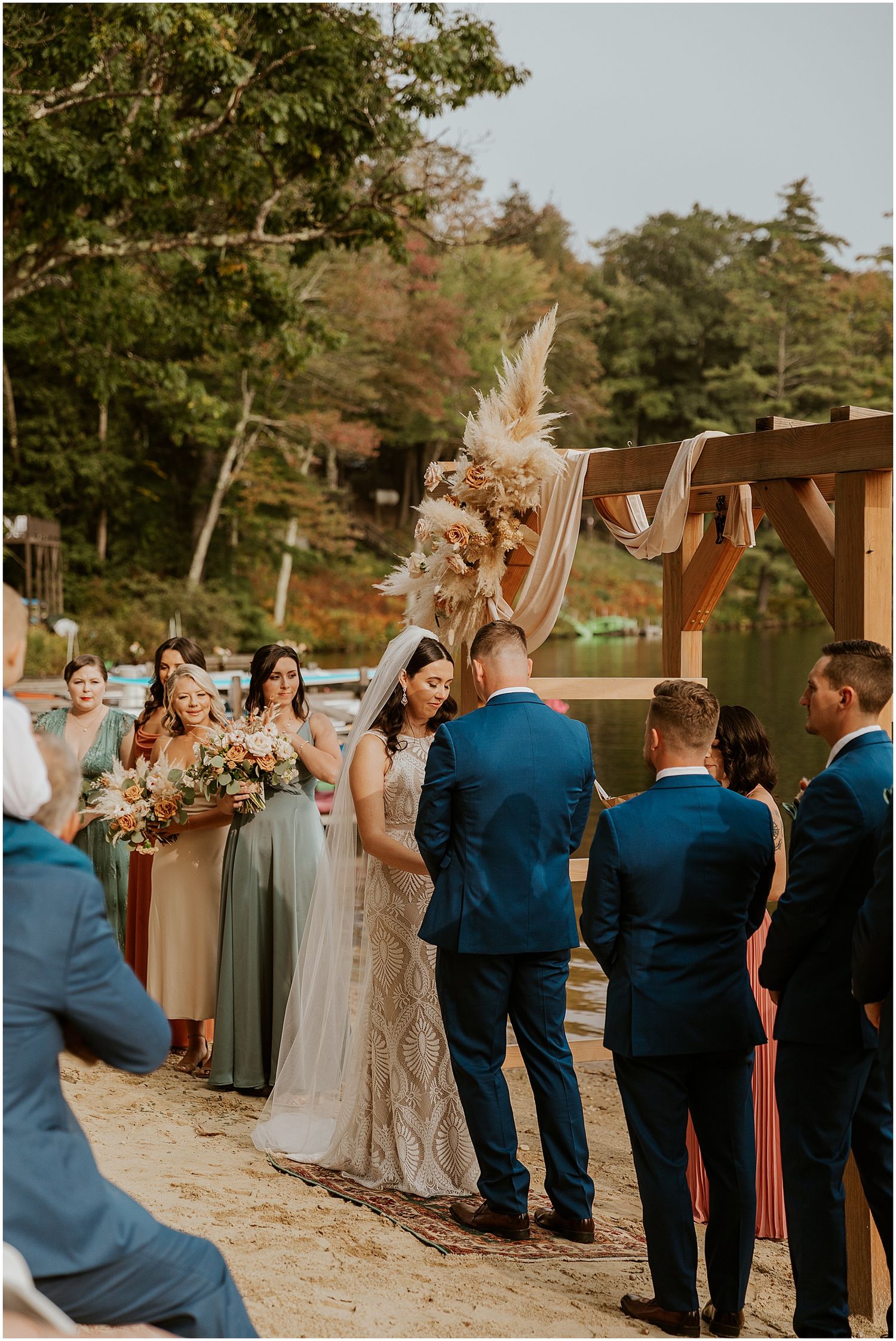 Wedding ceremony by lake in NH