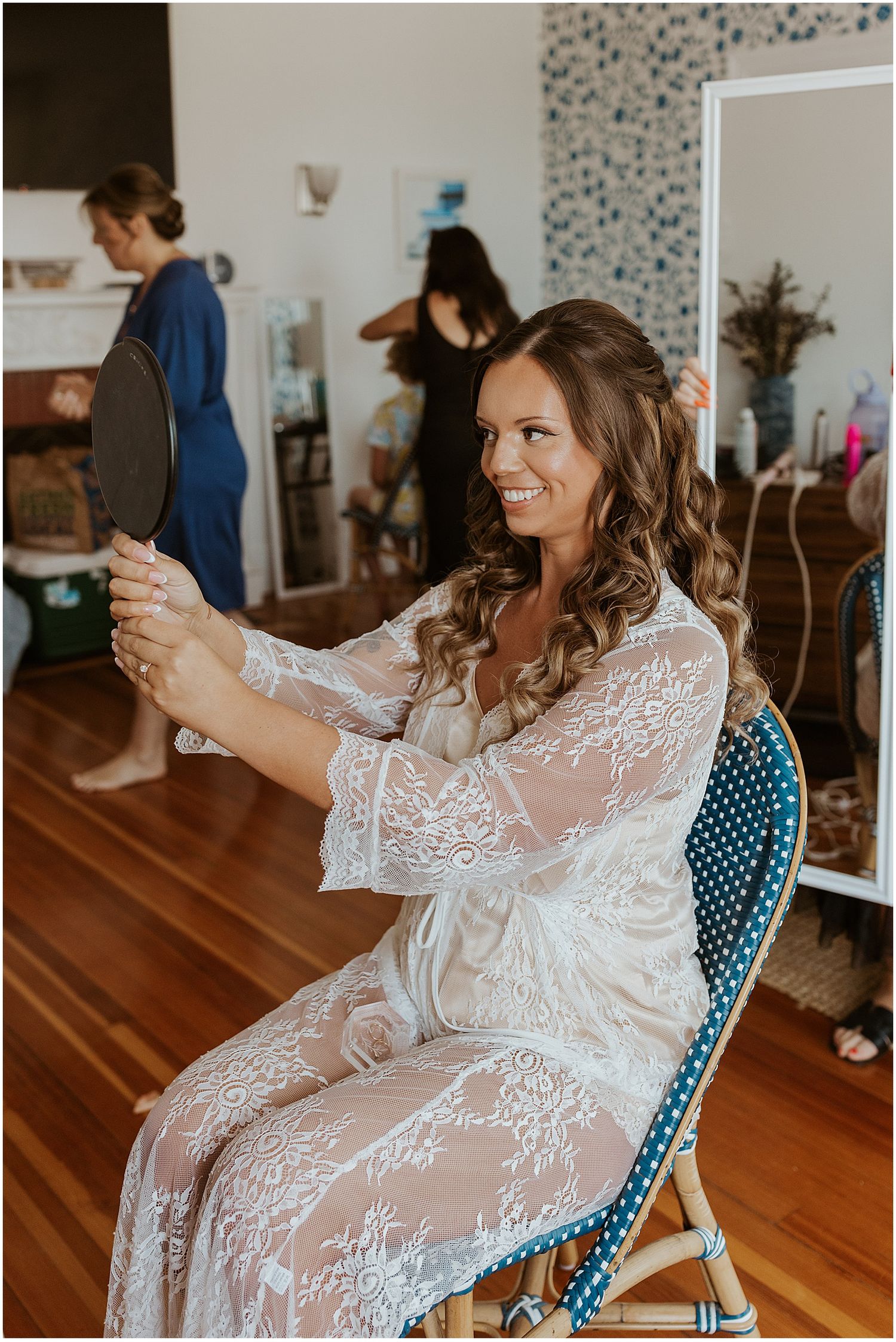 Getting ready wedding photos of bride doing her hair