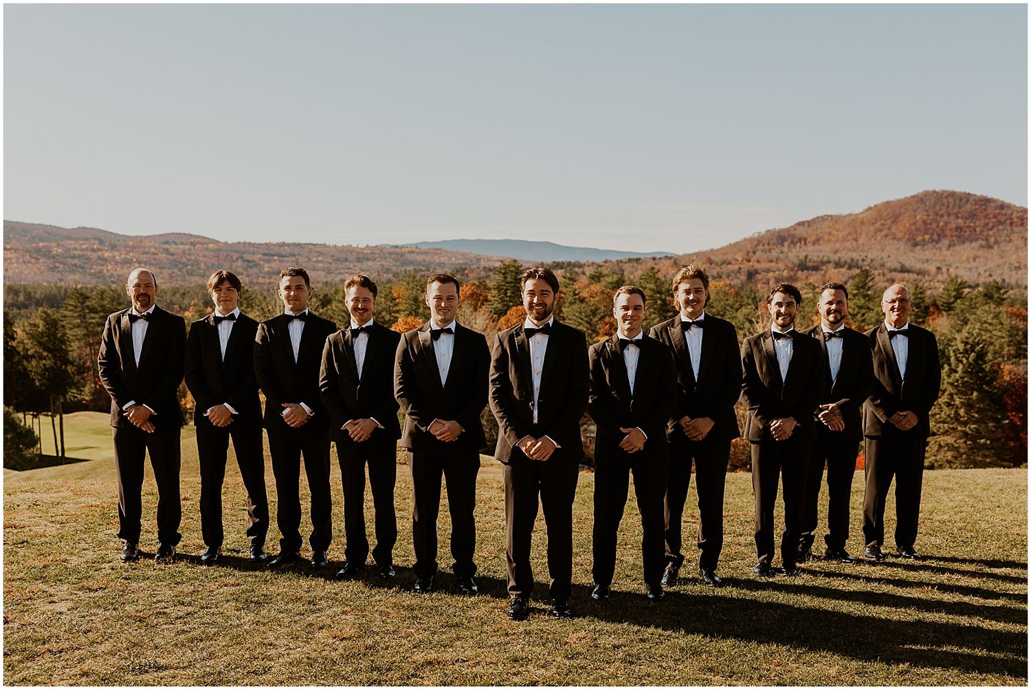 NH groom and groomsmen taking golden hour wedding photos