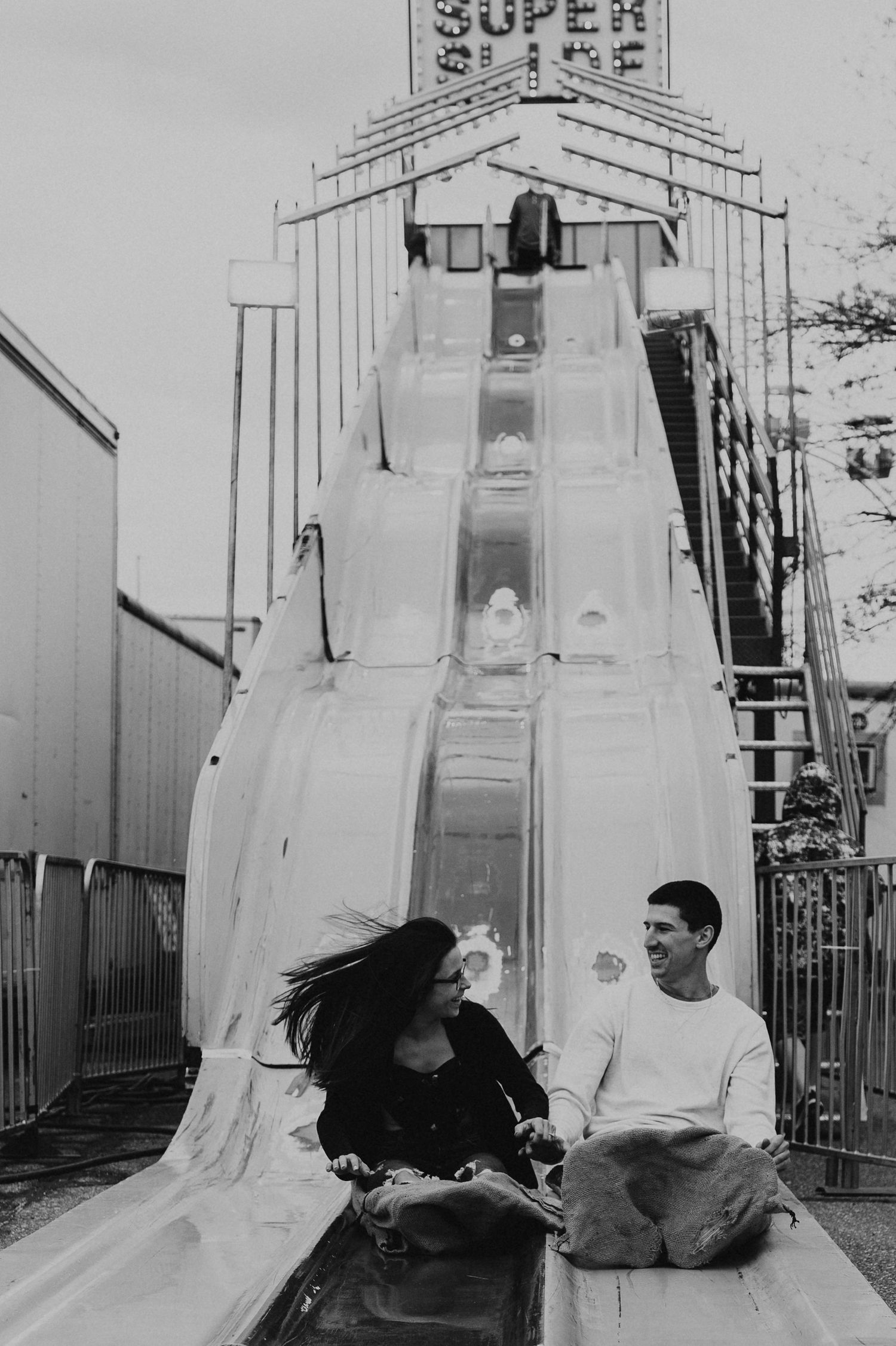Vintage black and white photo of a super slide carnival attraction.