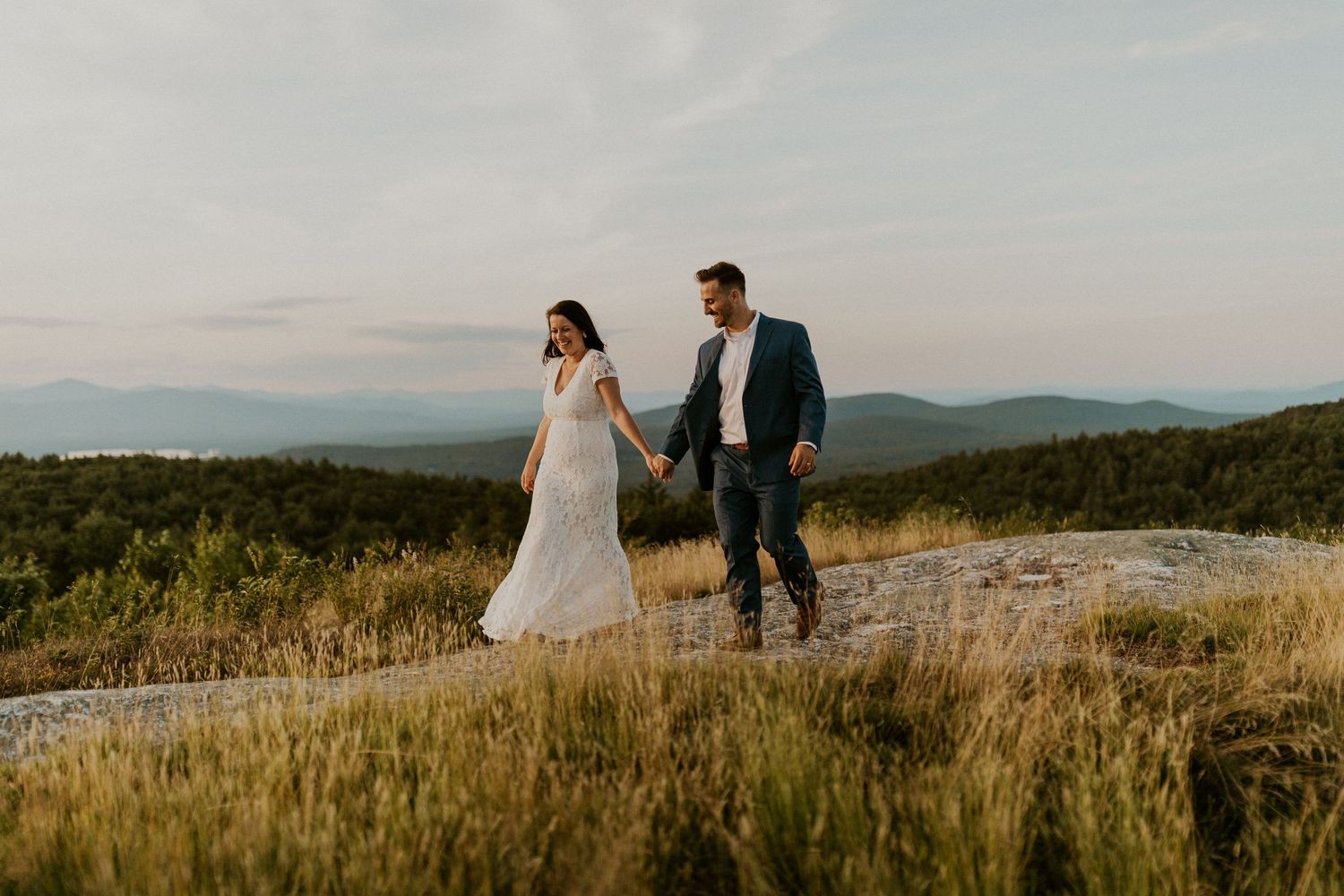 Danielle and Colin dressed in their wedding attire for their one year anniversary photoshoot on Foss Mountain in NH.