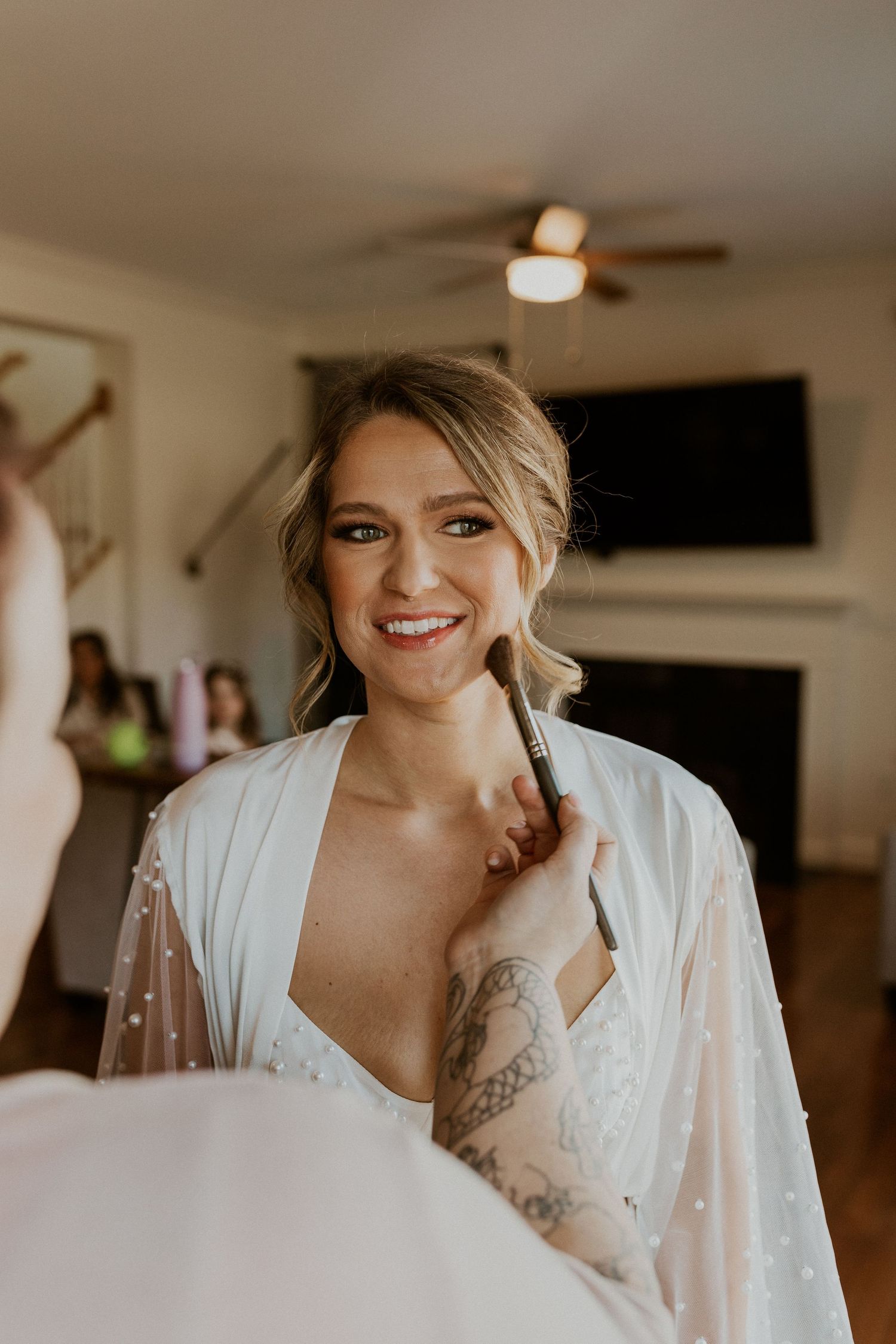 Kendra getting ready for the wedding ceremony at Owl's Nest Resort Lake House.