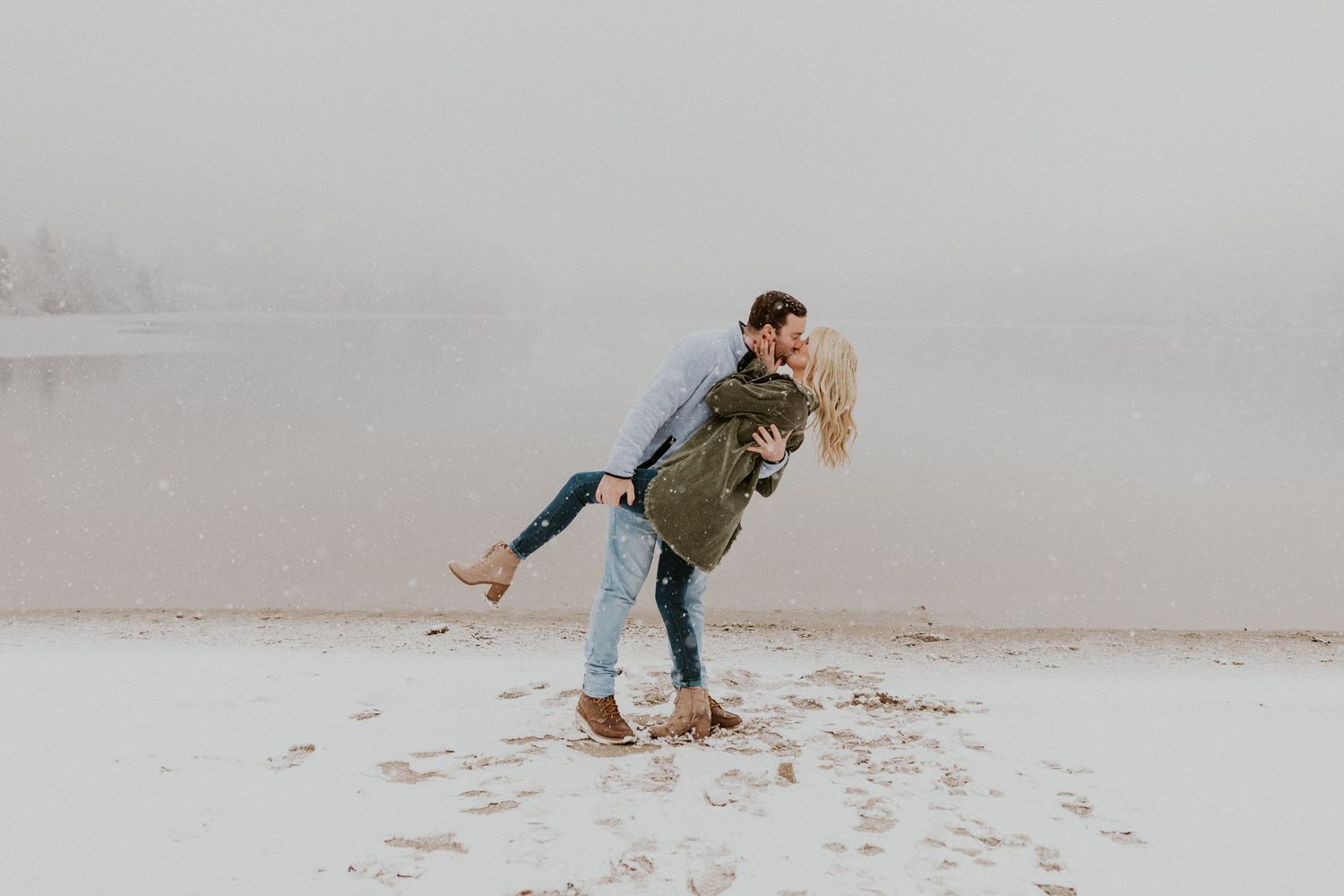 Newly engaged couple playfully posing for photos during their engagement session in Franconia New Hampshire.