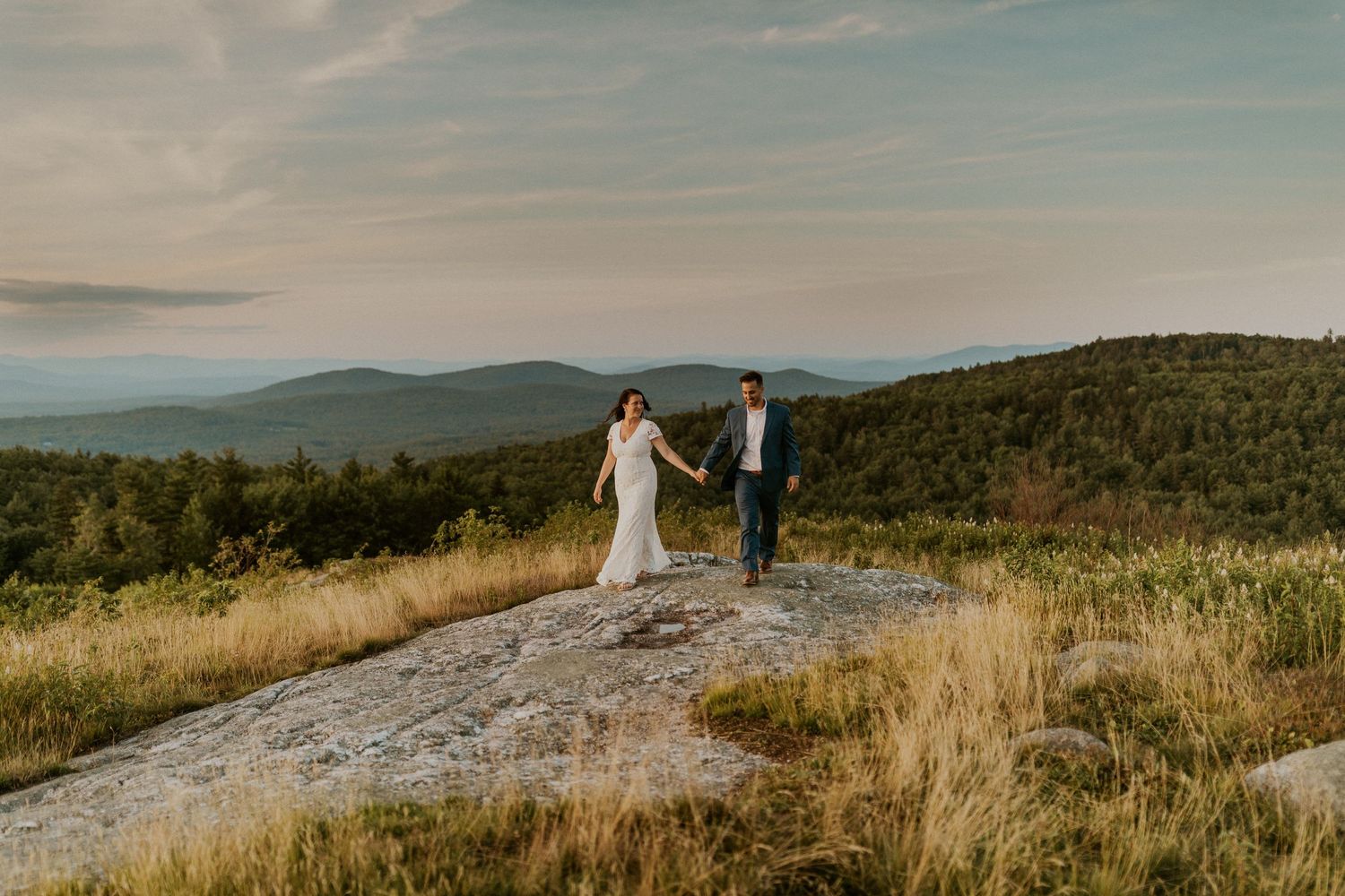 Danielle and Colin dressed in their wedding attire for their one year anniversary photoshoot on Foss Mountain in NH.