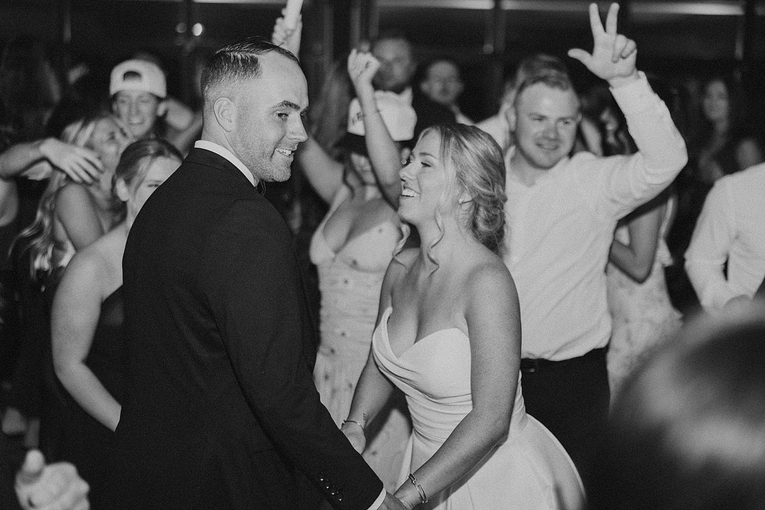 Bride and groom dancing with their guests at their Owl's Nest wedding in NH